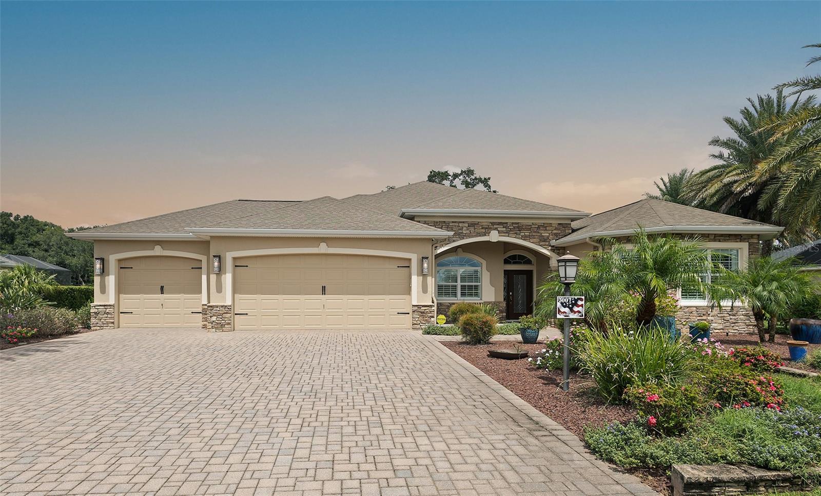 Welcome home to one of the MOST SPECTACULAR GOLF COURSE VIEWS IN THE VILLAGES! With no homes behind or roads in sight, this EXPANDED 3-bedroom, 2-bath Fully and Tastefully Furnished WILLIAMSBURG PREMIER in the VILLAGE OF PENNECAMP offers serene privacy and resort-style living. BOND PAID!
Step into a beautifully appointed interior with HARDWOOD FLOORS and DIAGONAL TILE floors, TRAY CEILINGS with decorative CROWN MOLDING, rounded corners, wainscoting, chair rails, and PLANTATION SHUTTERS. The chef’s kitchen features GRANITE COUNTERS, diagonal tile backsplash, stainless steel appliances, built-in induction/convection stove, double-door pantry with pull-outs, a large island with seating, and a sunny casual dining area with SOLAR TUBE LIGHTING THROUGHOUT. You'll LOVE the FURNISHING & DECOR PACKAGE - Designed by a local designer - INCLUDED WITH THIS AMAZING HOME.
The OPEN LIVING SPACES flow seamlessly to the lanai through STACKBACK SLIDING GLASS DOORS leading to the lanai & outdoor spaces framing the uninterrupted golf course views. Entertain effortlessly with a 36x16 SOLAR HEATED SALT-WATER POOL, gas-heated spa, travertine lanai, decorative columns, and a FULL SUMMER KITCHEN including a built-in beer kegerator and a built-in Alfresco grill and wall-mounted TV.
The Owner/Primary Suite is a PRIVATE RETREAT with hardwood floors, tray ceiling with fine craftsmanship in the crown and tray ceiling trims, French doors to the pool, dual walk-in custom closets, and en-suite bath with soaking tub, walk-in Roman shower with bench seating, dual sinks, and vanity.
The guest suite includes two spacious bedrooms with hardwood floors, wall-mounted TVs, large closets ( one is walk-in and one is built-in), a beautifully tiled bath with frameless glass shower and an expansive vanity top.
Additional highlights include a laundry room with built-in sink, 3-CAR GARAGE with EPOXY FLOORING, workshop space, custom exercise room, and a beautifully landscaped lot with pavered driveway, stacked stone accents, and lush tropical plantings. For peace of mind, the HVAC was replaced in 2019 and the Roof 2014.
This home is a rare combination of luxury, entertaining, and unparalleled golf course views, ready for you to move in and enjoy The Villages lifestyle to the fullest. Experience the charm of the Village of Pennecamp, where beautifully designed homes are complemented by a lively, welcoming community. Residents enjoy an active lifestyle with access to Lake Miona, nearby CHAMPIONSHIP AND EXECUTIVE GOLF COURSES, and endless opportunities for recreation and relaxation. The Pennecamp Neighborhood Recreation Center, located in the heart of this Viillage, is a hub for socializing, fitness, and fun activities, making it easy to meet new friends and fully embrace all that The Villages lifestyle has to offer.