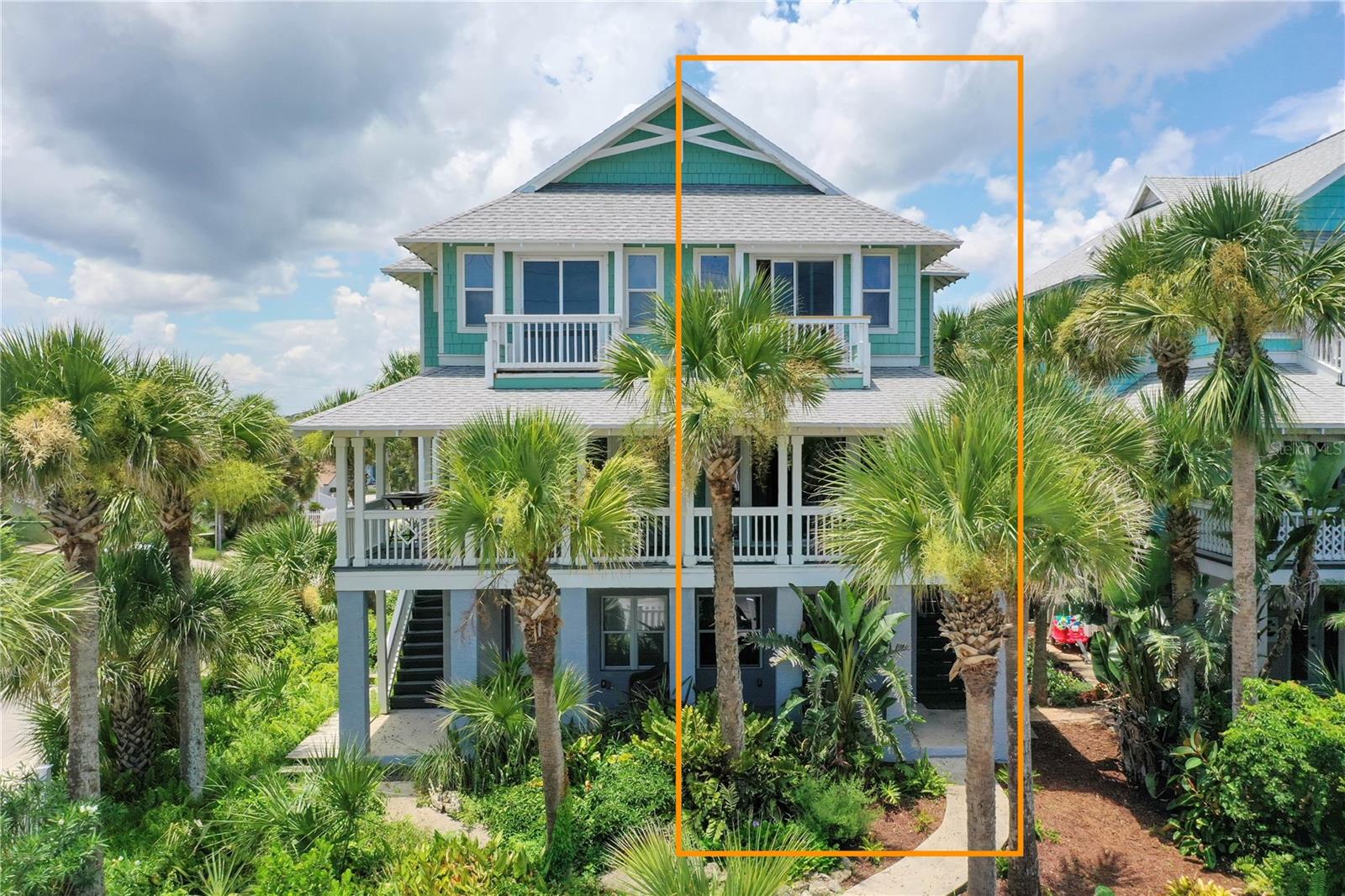 One or more photo(s) has been virtually staged. Charming Coastal Cottage Living—Just One Block from the Ocean! Welcome to 612 S Central Ave, part of the beloved Flagler Sea Cottages, locally known as the "Painted Ladies" of Flagler Beach. This enchanting attached 3-story single-family home occupies the right side of the building and is full of coastal character and modern charm. Wrapped in a white picket fence with a beautifully landscaped courtyard, the ocean breeze leads you just one block to toes in the sand. Tucked on the corner of Central Ave and 6th Street, this is one of only three homes in an exclusive seaside enclave, with private driveway and garage access from the 6th Street side. Step into the ground-level suite with its own entrance perfect for guests, in-laws, or even a private office complete with a full bathroom, walk-in shower, and a covered patio oasis. Inside entry is also available from the garage or via the outdoor staircase leading to the main living space on the 2nd floor.
Upstairs, enjoy a light-filled open concept living area with fireplace, dining space, and a well-appointed kitchen featuring an island, glass-front cabinetry, and pull-out shelving. Sliding glass doors open to an East-facing covered balcony with ocean peek views perfect for sunrise coffee while the West-facing balcony off the kitchen captures golden sunset skies. The 3rd floor is where the coastal magic truly unfolds. The primary suite boasts an ensuite bath with dual vanities and a jetted soaking tub, plus direct access to a private open-air balcony with sweeping views toward the Atlantic. A laundry closet and an additional guest bedroom with its own ensuite bath and west-facing window views complete the top floor. Freshly painted outside and complete with an outdoor shower for rinsing sandy toes, this home blends beachy elegance with laid-back Florida living. Don’t miss your chance to own a piece of iconic Flagler Beach charm, schedule your private showing today!