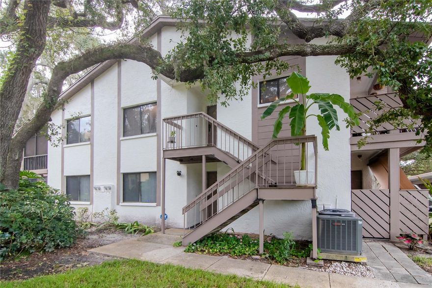 Discover this beautifully updated 3-bedroom, 2-bathroom condo located in the highly sought-after Yorktown at Beacon Place community in Safety Harbor. This spacious second-floor unit features an open floor plan with abundant natural light, a large living and dining area, and a fully renovated kitchen with shaker cabinets, granite countertops, and stainless steel appliances. The split-bedroom layout offers privacy, with a generous primary suite that includes a walk-in closet and updated en-suite bath. The two additional bedrooms are ideal for guests, a home office, or hobbies, and the second full bathroom has also been tastefully renovated.
Enjoy two private patios with new hurricane rated sliding glass doors—one in front with an exterior storage closet and one in the rear, perfect for relaxing or entertaining. The in-unit laundry room adds convenience, and a covered carport with additional private storage is included. The building is directly across from the community pool and clubhouse. The monthly condo fee includes cable, internet, water, sewer, trash, exterior maintenance, and more. Located just minutes from downtown Safety Harbor, shopping, dining, parks, and the waterfront.