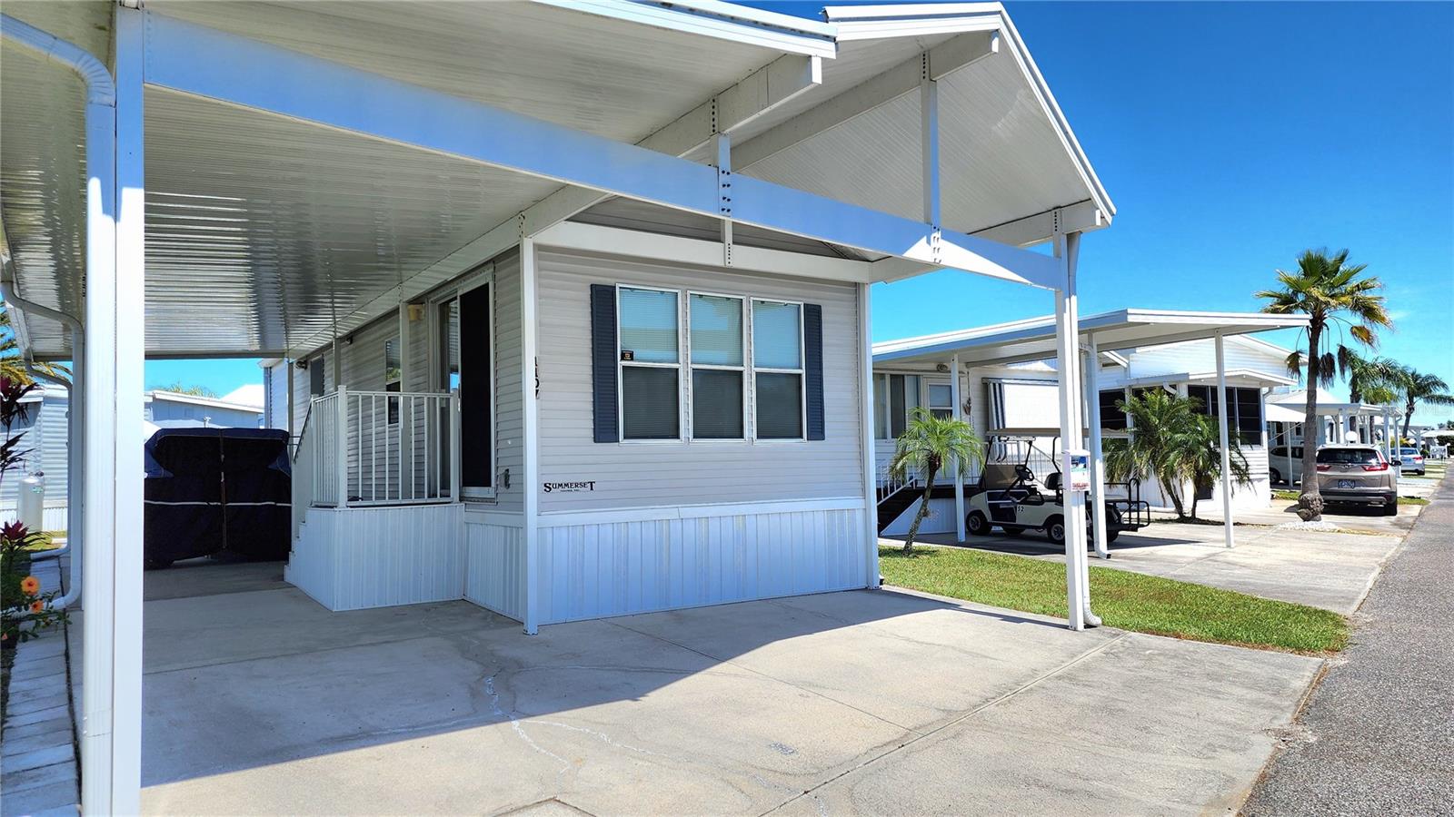 UPDATED SINGLE WIDE MOBILE HOME IN ACTIVE 55+ COMMUNITY! Stay warm in Florida in this furnished and well-kept home with one bed, one full bath, and large carport. The bedroom has a large built-in closet. The bathroom has a tub/shower and linen storage. There is a stacker washer/dryer. The carport gives plenty of covered parking and could also be used as a patio area. Shingle roof (2020). Central A/C (2016). Hot water heater (2023). The community of Sugar Creek Country Club features two swimming pools, heated spa, tennis & pickleball, shuffleboard, fitness room, club house, workshop, and an active social calendar during the winter months. LOW HOA FEES of just $525 quarterly which includes water, trash, sewer, basic cable, internet, and grass mowing. Enjoy this community's proximity to the Braden River and River Links Golf Course. Sorry this is not a dog lot.