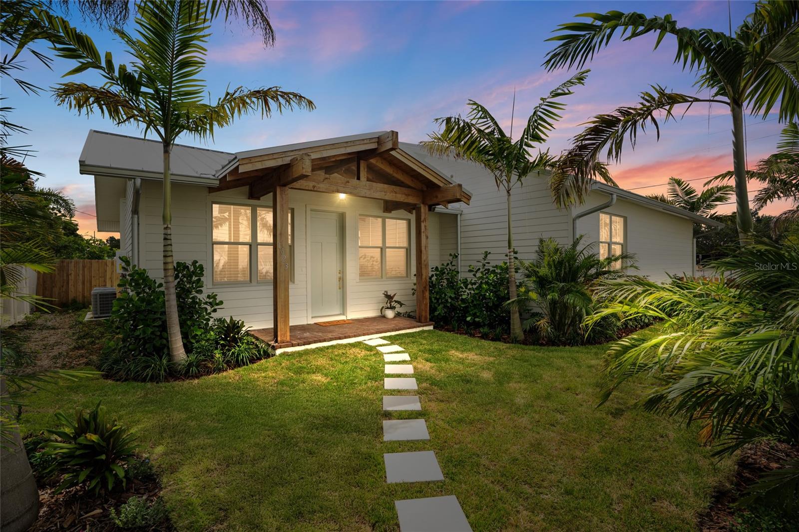 Welcome to your brand NEW dream coastal cottage in Magnolia Heights! Built by local home builder, Coastline Development, this rental features 1 bedroom, 1 bathroom, 685 SFT - situated along side two other available rentals (TB8410223 which is a 2/1 and TB8410331 which is a 3/2) and a two car garage -which is also available at additional fee per month. From the moment you arrive, you’re welcomed by a warm and inviting front porch with exposed cedar wood beams, brick pavers, and tropical landscaping that sets the tone for relaxed Florida living. Inside, the thoughtfully designed layout maximizes every square foot with smart functionality and stylish finishes. The open-concept living and kitchen area features durable wood-look tile flooring, all wood custom cabinetry, quartz countertops, and stainless steel appliances—ideal for both daily living and entertaining. Large windows bring in abundant natural light, creating a bright and cheerful atmosphere throughout the home. The spacious bedroom includes a custom walk-in closet with built-in shelving and a convenient stacked washer/dryer—making daily living effortless. The bathroom is a true standout, blending organic texture with refined design. A custom white oak vanity with rattan panel detailing adds warmth and sophistication, complemented by high-end fixtures, designer lighting, and beautifully tiled finishes. Rental rate to include lawn maintenance, natural gas, and pest control. Conveniently located in the heart of St. Pete - minutes to grocery, dining, breweries, shopping, and our vibrant DTSP! Easy access to I275 to Tampa or our beautiful sandy Gulf Beaches. Be the first to call this high-quality coastal retreat home — schedule your private showing today!