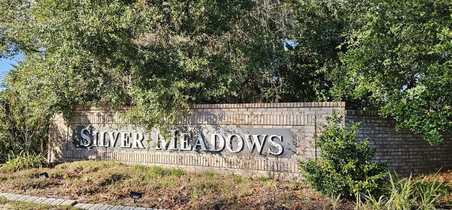 From the moment you arrive, you will be captivated by the peaceful and inviting ambiance that Silver Meadows North offers. The meandering road, lined with majestic oak trees, sets the tone as it leads you to a spacious vacant lot measuring 1.24 acres. Unlike busy city streets, this community embraces a natural and enchanting charm, with no street lights or curbs, allowing you to truly immerse yourself in the picturesque surroundings. As you take the time to explore the community, you will discover the charm and elegance that Silver Meadows has to offer. Stylish homes are nestled on large lots, each showcasing distinctive designs. With this vacant lot, you have a golden opportunity to design and build your dream custom home, tailor-made to your exact specifications and preferences. One of the many highlights of this community is the central location of the Recreation Centers within the  Community. At the heart of Silver Meadows, you'll find one of two Recreation areas, offering an array of amenities such as tennis, basketball, and racketball. Additionally, the lush green spaces provide the perfect setting for a leisurely picnic or outdoor gathering, creating a sense of community and enjoyment for residents. Bid farewell to the cramped quarters of city living and embrace the space and tranquility that this large lot in Silver Meadows offers. With its rural ambiance, gated community, and abundant recreational amenities, this vacant lot presents an exceptional opportunity to create the perfect retreat for you and your loved ones. Don't let this chance slip away – contact us today for more information and to schedule a viewing. Let us help you turn your dream of building a home in this sought-after location into a reality. Silver Springs State Park, Silver Springs Nature Theme Park, Ocala National Forest, Silver Springs Shores Golf & Country Club, Historic Downtown Ocala, Silver Springs Museum and Environmental Education Center, and Local Equestrian Facilities. These additional points of interest showcase the diverse recreational, cultural, and natural attractions that make Silver Springs, Florida an attractive location for potential home buyers