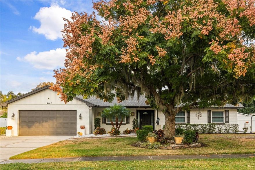 One or more photo(s) has been virtually staged. Welcome to 4102 Stonehenge Rd, a beautifully renovated home in the heart of Mulberry, FL. Nestled in a peaceful and welcoming neighborhood, this charming property offers a perfect balance of modern updates and timeless features that will make you feel right at home.

As you enter, you’re greeted by spacious, open living areas with newly renovated floors that flow seamlessly throughout the home. The cozy fireplace in the living room creates an inviting ambiance, perfect for unwinding after a long day. The bedrooms are enhanced by stylish barn-style doors, adding a touch of rustic charm to the space.

The bathrooms have been thoughtfully designed with unique, modern marble touches, giving them a luxurious and distinctive feel. Throughout the home, you’ll find the attention to detail that makes this property stand out.

Step outside to the expansive backyard, where you'll find a stunning patio area that is ideal for entertaining or simply enjoying the outdoors. The swing bench and lush landscaping add to the serene atmosphere, making this space perfect for relaxing or hosting friends and family.

The front and backyards are beautifully landscaped, offering vibrant colors and a sense of peace and tranquility. With a clean, well-maintained neighborhood and friendly neighbors, you’ll enjoy the privacy of a quiet street while still being close to everything you need. Local shops, restaurants, and parks are all just a short drive away, providing the perfect balance of convenience and comfort.

This is more than just a house; it’s a place where memories will be made. Don’t miss the chance to make this wonderful home yours. Schedule a showing today and see how it fits perfectly with your lifestyle.