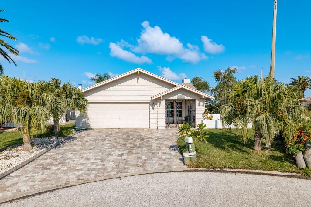 Where Every Day Feels Like Vacation - Gulf Harbors Woodlands Waterfront Gem! This split-plan, 3-bedroom, 2-bath home with a 2-car garage sits directly on Big Bayou’s pristine open water, overlooking the untouched beauty of the Robert Crown Wilderness Preserve Islands. Enjoy front-row seats to nature – watch dolphins play and manatees glide by – from your air-conditioned home, enclosed lanai, or private dock. A 10,000-pound boat lift and floating dock meet all your boating needs. Deep waterways provide quick, unobstructed access to the Gulf of Mexico in minutes! Enjoy Incredible sunsets! Inside, you’ll find a spacious, open floor plan with vaulted ceilings, a cozy fireplace, and a large eat-in kitchen. Roof (2015), HVAC system (2014), reinforced seawall, and EV hook-up. The Gulf Harbors Woodlands community offers a waterfront clubhouse, heated pool, tennis courts, and the private Gulf Harbors Yacht Club just across the cul-de-sac. Residents also have the option to join the exclusive Gulf Harbors Beach Club for a nominal annual fee. Don’t miss your chance to own this slice of paradise and savor breathtaking sunsets.