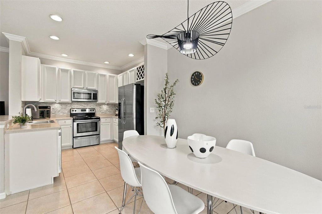 Photo of 9420 Georgian Park Lane #108, Tampa, FL 33626 (MLS # TB8555660)
