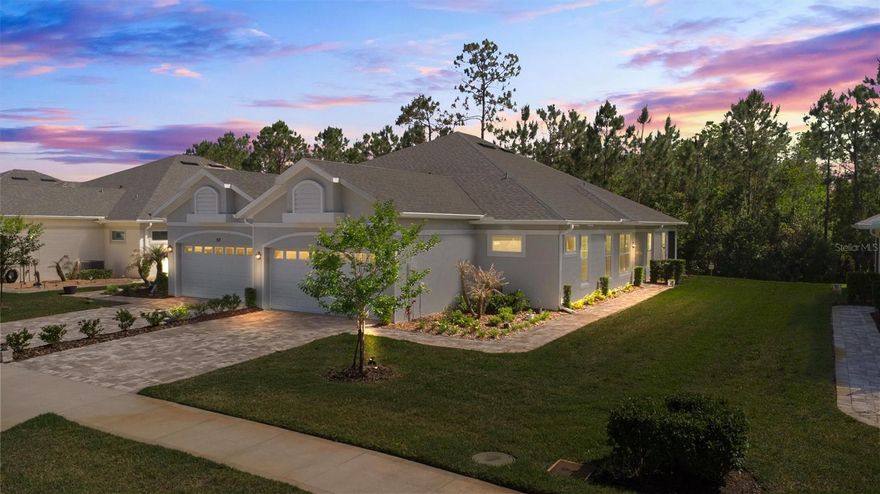 Welcome to effortless, low maintenance living in this beautifully maintained 2022 Dogwood model villa located in Huntington Village at Hunters Ridge in Ormond Beach. Soaring ceilings, storage galore, and high-end finishes throughout… where turnkey truly lives up to its name. Designed with a light, open feel, this 2 bedroom, 2.5 bath, 2 car garage residence offers a seamless blend of modern design and everyday functionality. Interior highlights include high end sealed tile flooring for pristine, low maintenance living, custom motorized window treatments, a spacious kitchen with pantry, and a convenient indoor laundry room. The main living area flows effortlessly to a private screened lanai, where lush, landscaped surroundings create a peaceful and private backdrop. What truly sets this home apart is the lifestyle. Hop on your golf cart and head to countless community amenities, including three pool options, with one reserved exclusively for Huntington Village residents, along with tennis, clubhouse, and recreational facilities. The Huntington Carefree Home™ Program enhances the ease of ownership by covering exterior maintenance and essential services including lawn care, irrigation, pest control, annual pressure washing, periodic exterior painting, and structural insurance reserves for the roof. High speed internet and television service are also included. Ideally located just minutes from shopping, dining, and the beach, this home delivers the perfect balance of comfort, convenience, and elevated Florida living. All information and measurements are intended to be accurate but not guaranteed and should be independently verified.
