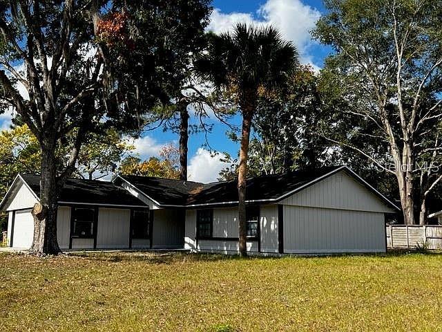 Totally remodeled home in NE Ocala This large corner lot home has all new cabinetry, STAINLESS APPLIANCES, a 7 1/2 foot eat on island, fireplace and a screened back patio. It is a three bedroom two bath, all new fixtures, new paint with vaulted ceiling, Vinyl privacy fence, Window Shutters were installed as well. Beautiful quartz countertops in kitchen and bathrooms, large pantry great home! Seller is offering $5,000 in concessions at Closing towards Closing Cost.