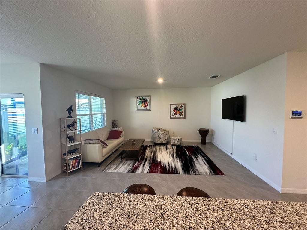 Photo of 1855 Egret Meadows Avenue, Kissimmee, FL 34744 (MLS # O6440117)