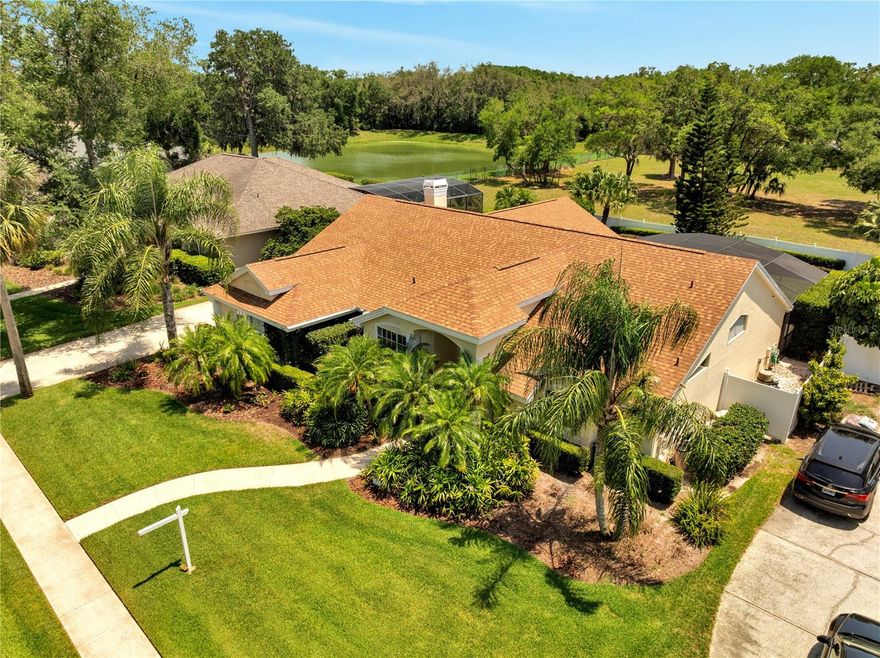 WELCOME TO PARADISE! Unbeatable price for this stunning, move-in ready custom pool home in Tuscawilla. Arbor Glen is a small, very exclusive community of just 38 custom homes located in the city of Winter Springs, which has been ranked among the best places to live nationwide for decades. Well-designed formal areas feature travertine, porcelain tile and engineered hardwood flooring and lots of light. The kitchen is a chef's delight, granite countertops and 42" solid wood cabinetry, GE convection microwave/oven and KitchenAid garbage compactor, open to the naturally lit family room with a wood-burning fireplace. It features an elegant foyer with hand-painted columns by local artists and a living room with panoramic views of the tropical, screened-in pool, spa, and waterfall. The lanai features a built-in JennAir electric grill ideal for barbecues. New pool enclosure and upgraded gutters. The master bedroom, living room, kitchen, and second master bedroom all have direct access to the pool and patio which backs up to a peaceful open area with no rear neighbors. The master suite includes a sitting area and a walk-in closet with a built-in combination safe. The master bathroom is very spacious, featuring a custom double vanity, Moen faucets, separate shower with brand new frameless doors and jetted tub.  A transferable home warranty plan is included, covering the repair/replacement of all electrical, plumbing systems and all appliances, including the pool pump and waterfall equipment. Security system with high-definition cameras installed around the property recording 24/7. A charming neighborhood and a fantastic place to call home. Arbor Glen at Tuscawilla is centrally located in Florida's #1 school district, also close to shopping centers, restaurants, central hospitals, golf courses, nature trails, beaches and main airports. This home is very versatile and perfect for both families and entertaining! THIS IS A MUST-SEE!