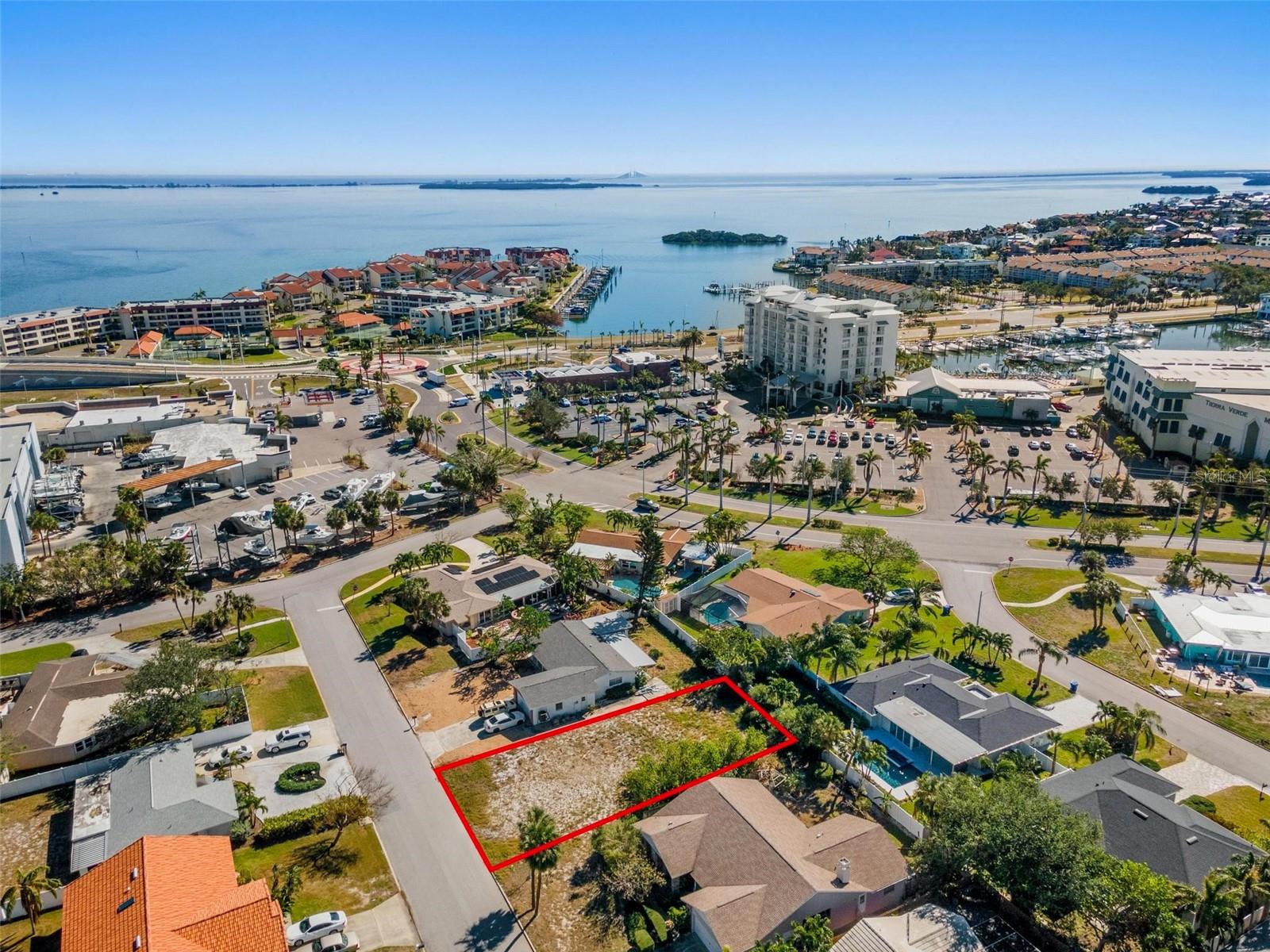 Great opportunity to build! Current elevation estimated at 9'. (Home on lot that next block over with 9' elevation did NOT flood in either storm.) Owners plan was to grade up to 11' elevation and still have one story home on this lot. (Similar home recently built nearby). This lot is unique as it has an INCREDIBLY HIGH WALKABILITY SCORE; so close to great restaurants (The Island Grille and Raw Bar, Circo's Italian Restaurant). Also close is a convenience store, liquor store, hair salon, and gas stations and a Subway; a great stop to grab some sandwiches before stepping onto your boat! Yes, the local HIGH AND DRY MARINA is also just a few steps away; SOOOO easy for boating. This is such a UNIQUE opportunity to live in a BEAUTIFUL waterfront community without being directly waterfront, and just a short drive from more restaurants as well as FT DESOTO PARK! Listing Agent is owner.