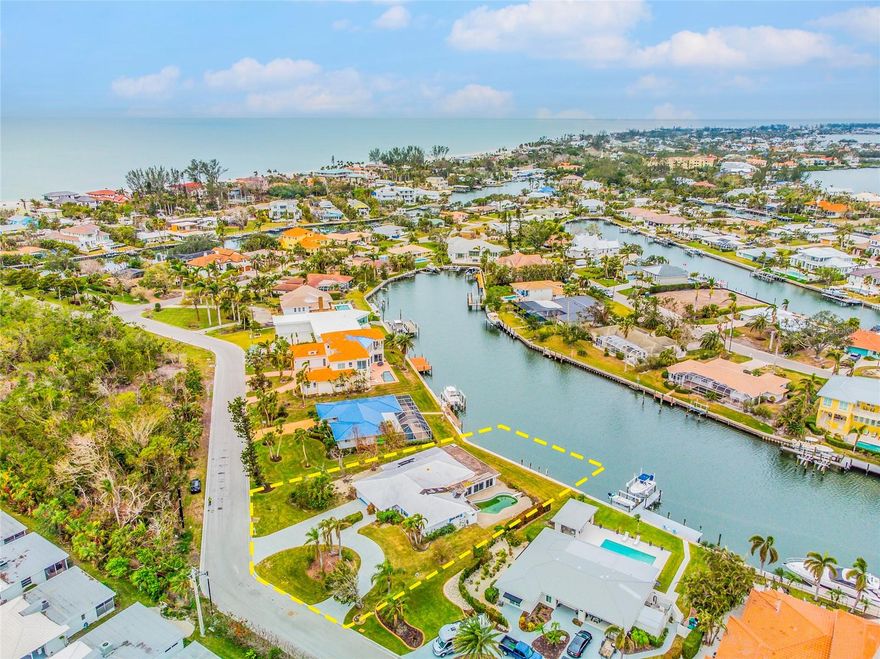 PREMIER LOCATION in Emerald Harbor -- HOUSE TO BE DEMOLISHED -- LOT IS GRADED AND READY TO BUILD -- Located on the apex of the WIDEST CANAL on Longboat Key, 721 Binnacle Point Drive is ready for a new owner with a new vision! The property has 96' of canal frontage with BRAND NEW Sea Wall (2024), 120' of street frontage, with just over 18,800 SF upon which to build your dream home. Build new and enjoy long views east and west down the canal and the beautiful light exposure. Emerald Harbor is one of Longboat Key's best neighborhoods - don't miss this opportunity to create your vision! There is a working, permitted sprinkler well on property. Private, deeded beach access for Emerald Harbor residents is just over 1100 feet away!

*The 3/3 home on the property that was damaged by Hurricane has been removed.