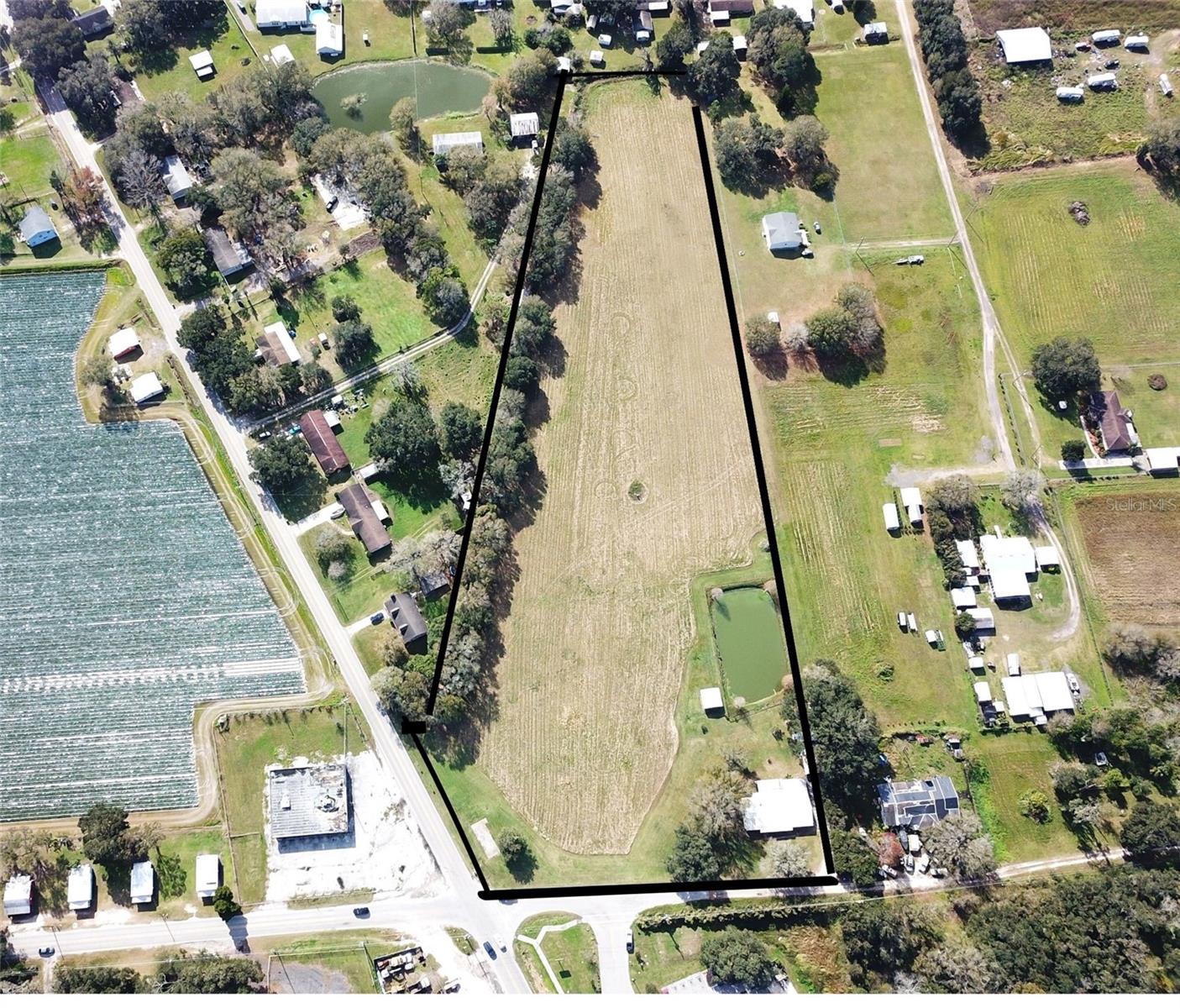 Don’t miss this exceptional opportunity to own 7.98± acres of versatile land in a rapidly growing area of East Hillsborough County. Ideally situated at the corner of Coronet Road and Medulla Road, this property offers both visibility and accessibility. This is a rare chance to invest in a mixed-use parcel with commercial potential at the intersection of two well-traveled roads. Whether you're an investor, developer, or business owner, this property offers a canvas for growth and long-term value. This sale includes 2407 Medulla Rd, Plant City, FL 33566.