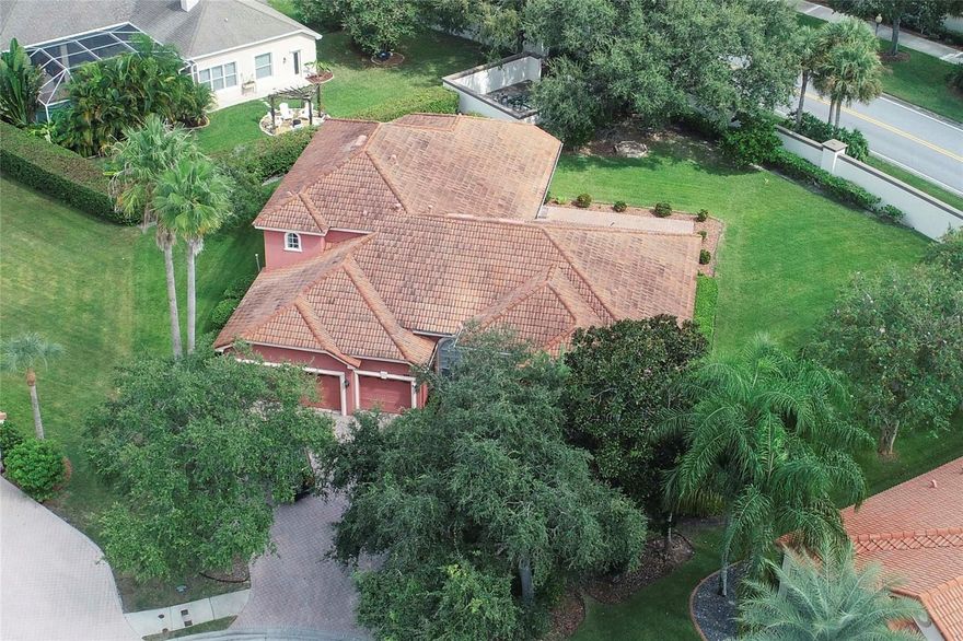 Welcome to the Private, Gated Community of Cielo at Champions Club.  This Executive Home has 3,499 sq ft. of living space, including 4 Bedrooms, 4 Full Bathrooms, Dining Room, Living Room, Gourmet Kitchen with Island and Granite Countertops, Big Family Room, an Office, plus a 24x14 Bonus Room and 4th Full Bathroom upstairs!! A Great Media Room, Play Room, or 5th Bedroom Suite!! Elegant Tray Ceilings in the Formal Dining Room and Living Rooms.  The Roof is Tile.  The Large Brick Patio and oversized Private Backyard are great for hosting gatherings and enjoying outdoor activities, can be easily screened in.  It sits on .39 Acres of Tropical Lushness!! Plenty of room for a pool if you wish. Home is located at the end of the Gated Cul de Sac, shady and gorgeous! The location is ideal, being just across from the Champions Club Clubhouse! Being a homeowner here, allows you Private and Gated Community Amenities, include: a  lovely Resort Style Pool, the Championship Fox Hollow Golf Course, Tennis Facilities, Fitness Center, Spa, and Community Activities. Being part of the Champions Club adds another layer of luxury to this prime area of West Pasco .  Also near shopping, restaurants, top-rated schools, medical facilities. Fast and easy access to the Suncoast Parkway for a quick commute to Tampa. Call for a chance to see this beauty today!