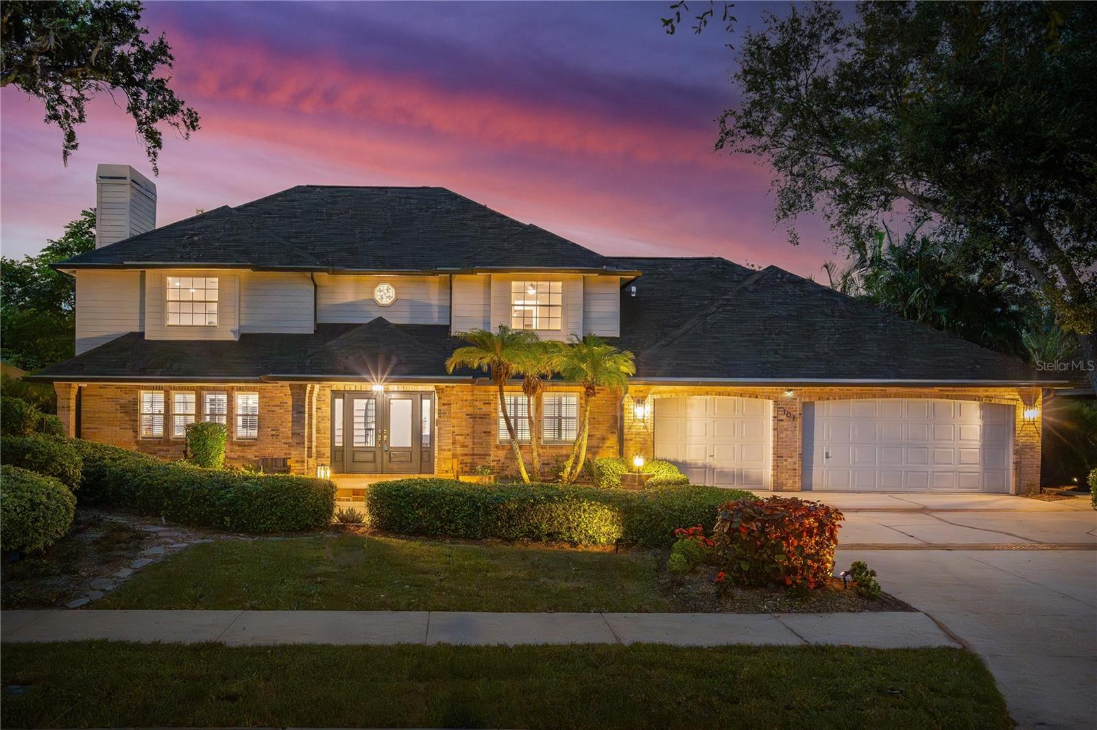 This stunning home is an incredible opportunity to own a professionally designed, fully renovated home in one of Belleair’s most coveted locations—just one block from Pelican Golf Club and directly across from a beautiful neighborhood park. The entire floorplan has been drastically improved and reimagined. With timeless style, thoughtful upgrades, and high-end finishes throughout, this home offers the kind of space, functionality, and craftsmanship rarely found in this price range. No expense was spared in the renovation, featuring top-of-the-line Thermador appliances including a 48" built-in refrigerator and 36" 6-burner gas range, all new impact-rated exterior and interior doors, beautiful engineered hardwood flooring, and custom cabinetry throughout. The bright kitchen is complimented by a dual-function butler’s pantry and laundry room with extensive cabinetry, countertop space, and a third sink. The layout includes dual primary suites—one on the main level ideal for guests or multi-generational living, and a luxurious upstairs retreat with a spa-style bath and expansive walk-in closet. A dramatic two-story foyer, bonus playroom, and oversized three-car garage provide flexibility for modern living, while the 13,000-gallon saltwater pool with new equipment and heated spa is surrounded by a spacious brick-paved entertaining area. The fifth bedroom could also serve as a perfect office. The home is complete with two gas fireplaces, premium designer fixtures, three HVAC zones each with Nest WiFi-enabled thermostats, and a beautifully landscaped backyard with new sod, irrigation, and lighting. Topped off with a brand-new roof, this home combines luxury, comfort, and location in a way that’s rarely available.