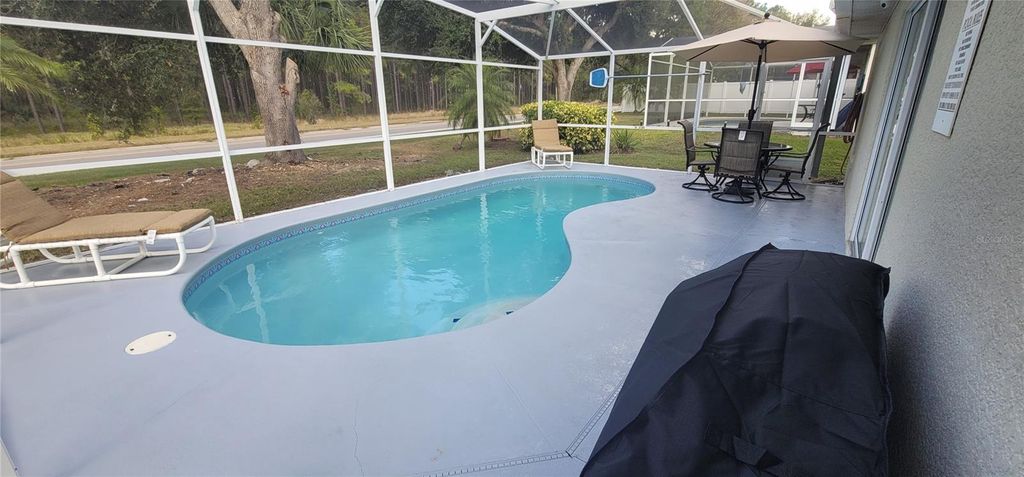 Photo of 730 Pine Cone Drive, Davenport, FL 33897 (MLS # O6384732)