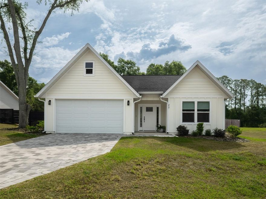 Light, airy, and impeccably finished, this beautifully-maintained  3-bedroom, 2-bath home delivers the kind of effortless Florida living that's hard to find. Built in 2024 by a trusted local builder with an eye for quality, it's nestled in a small, intimate, no-HOA community with underground utilities — quiet and uncluttered, yet convenient to everything you love about Newberry. ~~
Step inside to soaring 9-foot ceilings throughout and an 11-foot vaulted ceiling in the great room that adds an impressive sense of openness. The split floor plan flows effortlessly from living to dining to kitchen, where granite countertops, a center island, generous cabinetry, and ample counter space come together in a kitchen designed to impress. A walk-in pantry adds thoughtful, practical storage without sacrificing style.
Luxury vinyl flooring runs throughout the entire home — no carpet anywhere — offering a clean, polished look that's as sophisticated as it is low-maintenance. The finishes here are a cut above, and it shows. Out back, the covered patio and yard give you room to breathe, entertain, or simply enjoy the Florida outdoors. ~~
Perfectly positioned just minutes from the heart of downtown Newberry and an easy drive to Gainesville, this home offers the best of both worlds. Bright, refined, and genuinely move-in ready — this one checks every box!