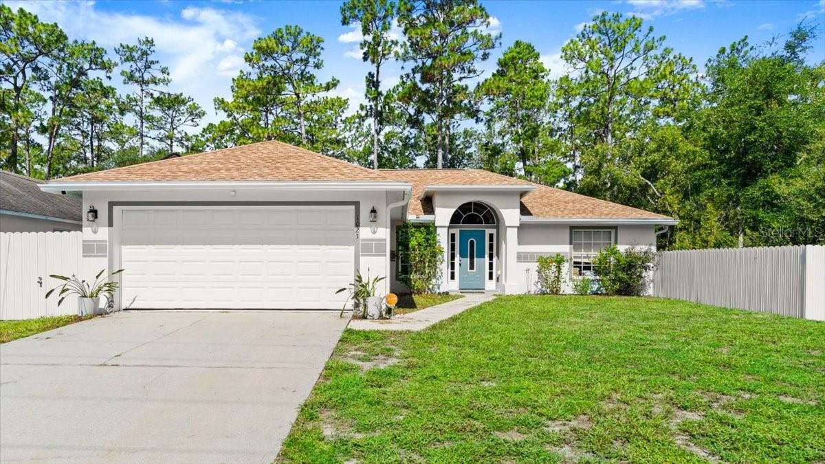 Welcome to 1023 Gage Avenue, where comfort meets convenience in the heart of Deltona! This charming home offers a perfect blend of peaceful suburban living with unbeatable access to everything Central Florida has to offer. Just 1 hour to Orlando International Airport, 35 minutes to the sunny shores of New Smyrna and Daytona Beaches, and short distance from I-4, this location makes commuting, traveling, and weekend getaways a breeze. Step inside to a warm and inviting space featuring an open living area, updated kitchen, 2022 roof, 2024 screen enclosure and a spacious yard with a new, durable aluminum fence. Let's not forget the New solar panels bringing your electric bills down for the ultimate cost savings!—ideal for families, first-time buyers, or your part time Florida residence! Enjoy quiet neighborhood living with close proximity to parks, schools, shopping, and dining. Whether you're heading to the theme parks, airport, or soaking up the sun on the coast, this home puts you right in the middle of it all.