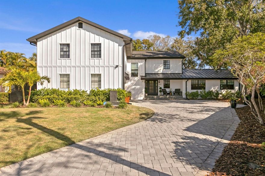 Welcome to this beautifully renovated and impeccably maintained 4-bedroom, 4.5-bathroom home.  Every room has been thoughtfully designed to reflect a modern farmhouse aesthetic while offering the perfect combination of style, comfort, and functionality.  Nestled on a quiet cul-de-sac in desirable Beach Park Isle, this is the perfect family home!  This home has NOT been affected by previous hurricanes.  The open-concept floor plan features a spacious and light-filled kitchen that includes a cozy built-in breakfast nook and an expansive island.  Sliding glass doors seamlessly connect the kitchen to the covered outdoor patio and pool area-ideal for al fresco dining and entertaining!  An impressive addition to the home has added a generous great room designed for family gatherings, movie nights, and game days. A sun-filled dining and sitting area completes the first floor, with the addition of a fireplace to gather around.  Upstairs, you will find four beautifully appointed bedrooms, each with its own private ensuite bathroom, ensuring maximum privacy and comfort. A bonus flex space provides yet more possibilities for an office, workout space, or creative studio. Notable interior upgrades since May of 2025 include all new Kitchen appliances and a new centre island, all new blinds and window treatments, a new master custom closet, new carpet, whole house interior paint, a new water softening system, and so much more.  A new roof was also added in 2024.  Located in the coveted Mabry, Coleman and Plant school district, this home truly has it all