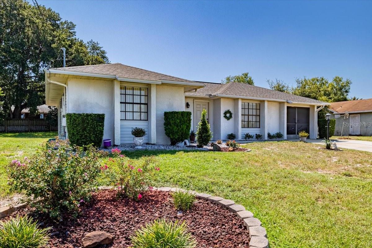 ***SELLER-PAID HOME WARRANTY INCLUDED*** Buyers - ask your agent for full info! Step into your new Meticulously Maintained, Move in Ready, 2-Bedroom, 2-Bathroom home, complete with a fully functional screened garage located in the heart of Deltona. Recent upgrades to this pristine home include a brand-new roof (July 2025), fresh concrete on a large portion of the driveway (July 2025), and tasteful landscaping touches (July 2025), which will ensure peace of mind as well as curb appeal for many years to come. Situated on an elevated ¼ acre lot on a private cul-de-sac, this home offers both comfort, privacy, and convenience with NO HOA restrictions. A spacious front yard
welcomes you to this lovely home located just 30 minutes from the beach. Additionally, it’s only a short ride to Orlando and all its world-renowned attractions. Inside this residence you will find two immaculate bedrooms, two spotless full baths, with an ample sized primary suite which includes a brand-new shower with upgraded fixtures and a large walk-in closet. This home also features a combination of low maintenance ceramic tile and laminate flooring throughout the living areas and bathrooms, while the primary bedroom boasts plush carpeting and ceramic tile. The spotless kitchen features a cozy dining nook / living room combo for small or larger groups with a separate front living room for social gatherings and entertainment. The cozy backyard offers a fully screened in patio giving you a comfortable and safe retreat to gather and enjoy the outdoors. It also features a detached shed for additional storage space. This property combines
timeless style, functionality, and peace of mind all wrapped in a premier location, making it a true gem. Schedule your showing today and prepare to fall in love with your new home!