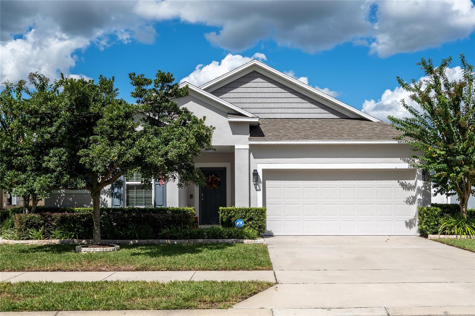 Welcome to this beautifully maintained home located in one of DeLand’s most desirable communities—just minutes from historic Downtown DeLand, known for its charming restaurants, boutique shopping, and vibrant entertainment scene. Step inside and enjoy an open-concept layout designed for modern living. The home features upgraded Minke Air ceiling fans, dimmers on all lighting, and a whole-home soft water system—combining comfort, style, and efficiency. The kitchen flows seamlessly into the living and dining areas, creating the perfect space for gatherings and everyday living. The chef in the family will appreciate the large quarts kitchen island, stainless steel appliances, and all of the counter and storage space. Another great feature is a dedicated office space/flex room with double French doors. This space is just right for those managing a home business, or those who work remote. The Primary suite features tray ceilings, walk in closet, and a large bathroom with a glass shower enclosure, double vanities and a beautiful freestanding bathtub. The additional bedrooms are spacious with nice sized closets. Enjoy Florida living at its best with a private, fully fenced backyard, ideal for relaxing, entertaining, or letting pets play freely. You will also enjoy the screened lanai year round! Located just minutes from scenic trails and parks, this home offers the perfect balance between convenience and outdoor adventure.