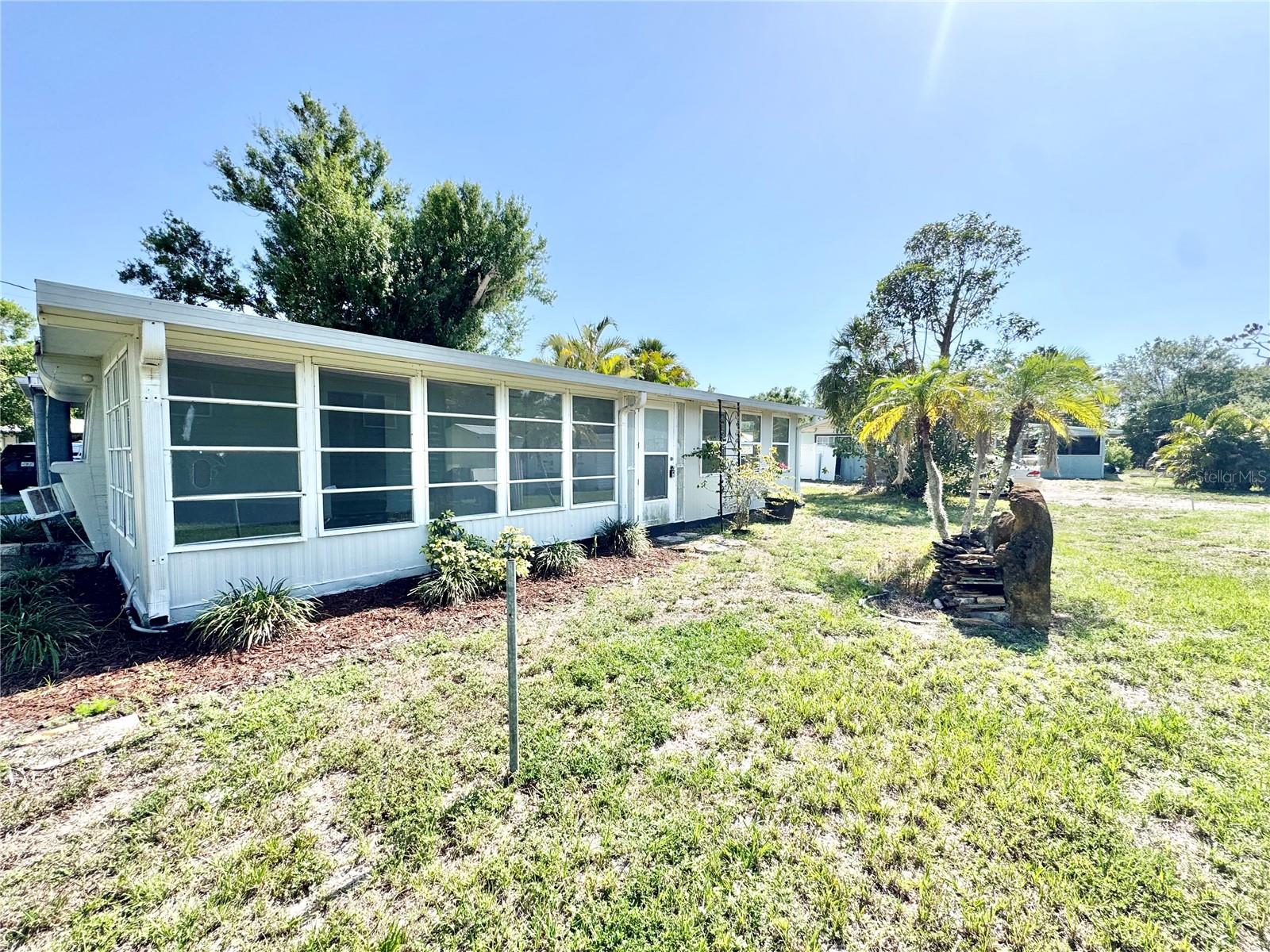 Currently rented until August 2026 for $950/month. Start your investment easy with an already placed renter. Don’t let the size fool you—this cozy, modified 1 bed, 1 bath mobile home packs a punch when it comes to comfort and character. It’s the perfect retreat for simple living with a twist: think "home sweet home" in the front and a party-ready vibe in the back. Nestled in a peaceful, beautiful neighborhood just minutes from Charlotte Harbor and under 5 minutes to I-75, you’ll enjoy quick access to all the essentials while still soaking in that laid-back, country feel. The oversized carport adds convenience, and the home is hooked up to city water—just move in and relax. Ready to trade square footage for lifestyle? This gem is calling your name.
