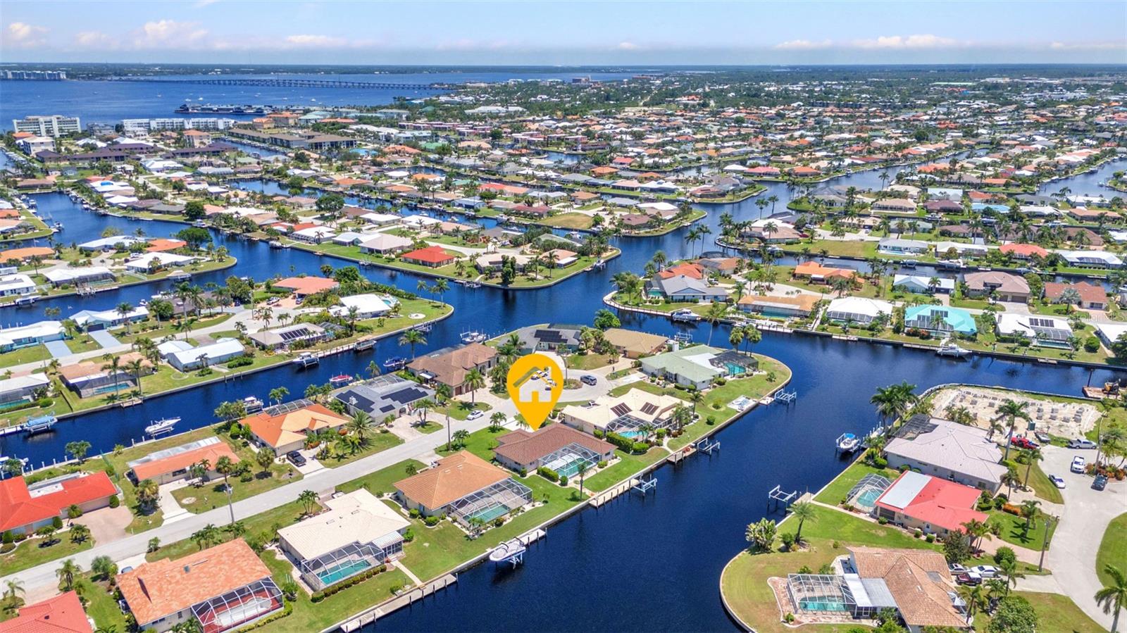 **Stunning POOL HOME with INTERSECTING CANAL WATERFRONT VIEWS from your private lanai. Welcome to your dream retreat nestled in the heart of Punta Gorda Isles, where every day feels like a vacation! This exquisite home boasts breathtaking views of intersecting canals, offering a serene backdrop for both relaxation and entertainment. Privately located at the end of a cul-de-sac (full of wildflowers), this exquisite waterfront home offers an unparalleled Florida lifestyle with QUICK BOATING ACCESS to the majestic waters of CHARLOTTE HARBOR and beyond that surround Punta Gorda. Whether you’re a fishing enthusiast, a boating aficionado, or simply love the tranquility of living by the water, this property is tailor-made for your dreams. Step inside and discover an open concept living space flooded with natural light and designed for both comfort and elegance. The renovated kitchen is truly the heart of this home, boasting gleaming quartz countertops, modern cabinetry, and top-of-the-line stainless steel appliances! Open-concept living areas flow seamlessly to create an inviting atmosphere perfect for entertaining family and friends. With 3 BEDROOMS with BONUS ROOM and 3 FULL BATHROOMS this spacious design includes multiple living and dining areas where you can unwind after a day on the water or entertain all of your family and friends . Each room reflects care in detail with tasteful upgrades throughout—ensuring each corner feels like home including the 2 CAR GARAGE WITH NEWLY PAINTED FLOOR. As you step outside into your private oasis, indulge in sun-soaked days lounging by your sparkling pool or hosting summer barbecues on your SCREENED LANAI ALL OVERLOOKING THE WATERWAY! **IMPORTANT attributes including engineering for peace of mind with like a NEW METAL ROOF and FULL HURRICANE PROTECTION throughout, ensuring safety without compromising style. Whether you're basking on your private dock or entertaining friends in your spacious backyard oasis, you’ll appreciate how this home perfectly harmonizes waterfront living with practical features like your very own 45 FT. FOCK COMPLETE WITH BOAT LIFT - ideal for boating enthusiasts and adventurers ready to explore the limitless waterways that define this vibrant community. CALL TODAY FOR THE FULL LIST OF UPGRADES AND A PRIVATE SHOWING!