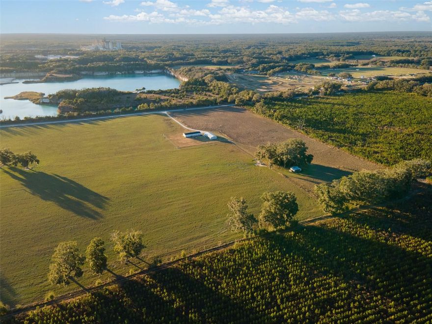 Discover the rare opportunity to own a full 40-acre farm on the border of Newberry and Jonesville—just minutes from Gainesville amenities, yet far enough to enjoy the peace and tranquility of country living. This expansive property features prime pasture land, ideal for horses, cattle, livestock, or other agricultural pursuits. This property is also the perfect location for a creative developer/builder currently subdivided into 10 acre lots but with the potential for a 5 acre lot subdivision. A large dog kennel and multipurpose pig pen with concrete pad and multiple adaptable stalls offer flexible space for animals, storage, or other functional uses. Mature Grandaddy Oaks and wide-open fields create the perfect backdrop for your dream homestead, farm, or private retreat. Enter through a beautiful wrought iron gate down a long driveway to a 2,300+ sq ft home with a detached 3-car carport with garage/storage and a 690 sq ft climate-controlled finished space—perfect as a guest suite, man cave, office, mother-in-law suite, or Airbnb potential. Inside, the main home is built to Category 3 hurricane standards and features an open-concept great room with tray ceilings and crown molding, flowing seamlessly into the kitchen and dining areas. The kitchen boasts a large island, stainless steel appliances, gas range, walk-in pantry, and abundant storage. The split floor plan offers a primary suite with walk-in closet and spa-like bath, plus three additional bedrooms and a full bath on the opposite side of the home. Enjoy Low-E insulated windows, LED lighting, wood cabinetry, stainless appliances, and expansive covered front and back porches—perfect for taking in the serene surroundings and country sunsets. With no neighbors behind, beside, or across the street, this property provides unparalleled privacy and freedom. This property has also already been subdivided into four 10 acre parcels should you decide you want to sell any of the acreage down the line. The work has already been done for you. Whether you’re looking to build your dream homestead, start a farm, or simply enjoy open country living, this 40-acre estate is a once-in-a-lifetime opportunity. Schedule your private showing today and make this exceptional property your own!