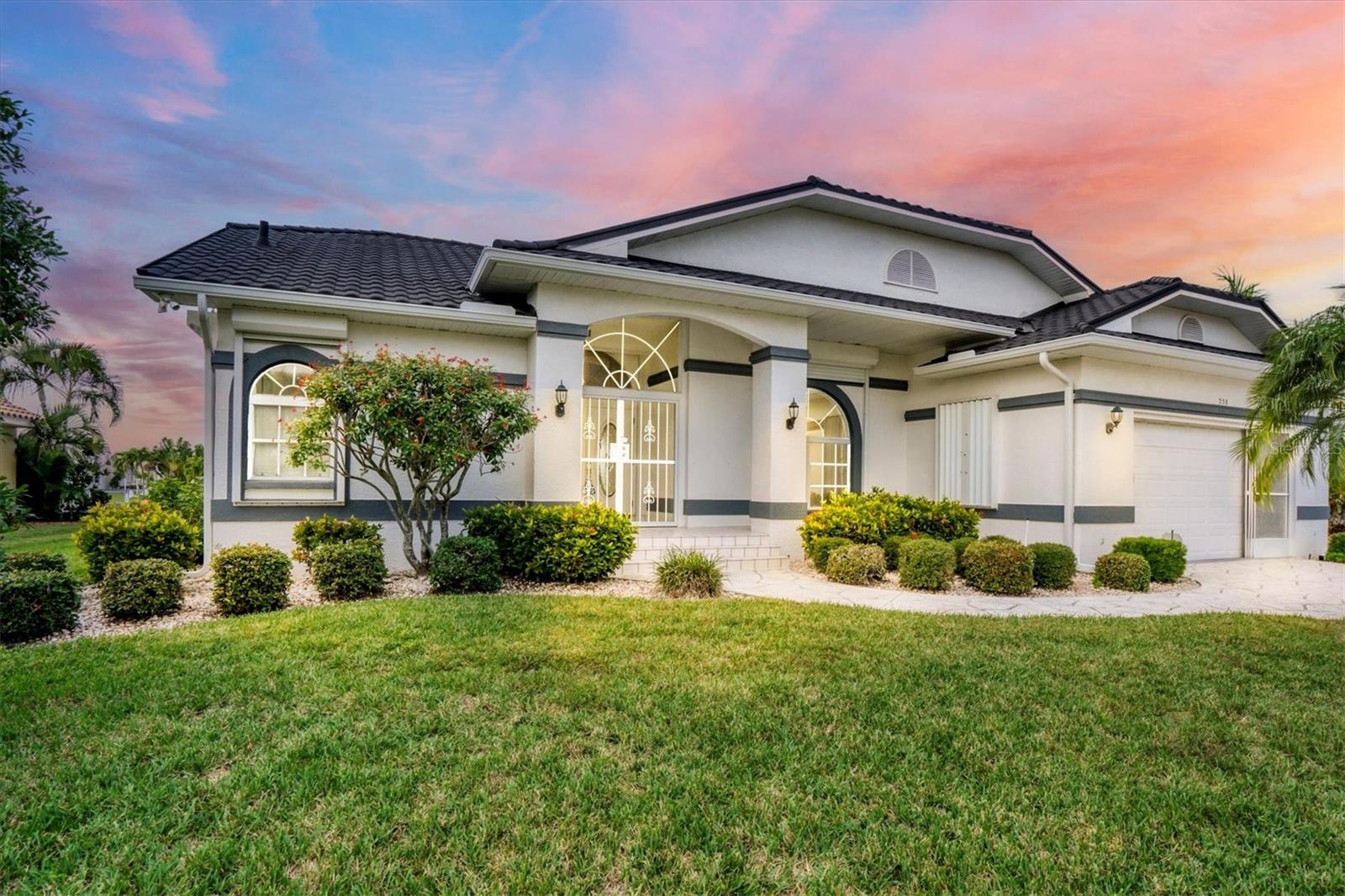 Motovated seller,Gorgeous Waterfront home, in Sought after Burnt Store Isles with Sail Boat access with beautiful Water Views. Deep water access to Charlotte Harbor. NEW ROOF and POOL CAGE in 2023, Freshly painted Interior and Exterior, New Kitchen with Quartz Counter tops,Stainless Steel Appliances, Updated Bathrooms, New Carpet in Bedrooms and HVAC replaced in 2018. Formal Living room and Dining room, Spaciuos Family room . Interior of home offer high ceiling and crown molding. Lots of natural light, outdoor space perfect for entertaining with a concrete dock. Hurrican protection including Acccordin Shutters and Power Shutters This is a must see, priced to sell will not last long.