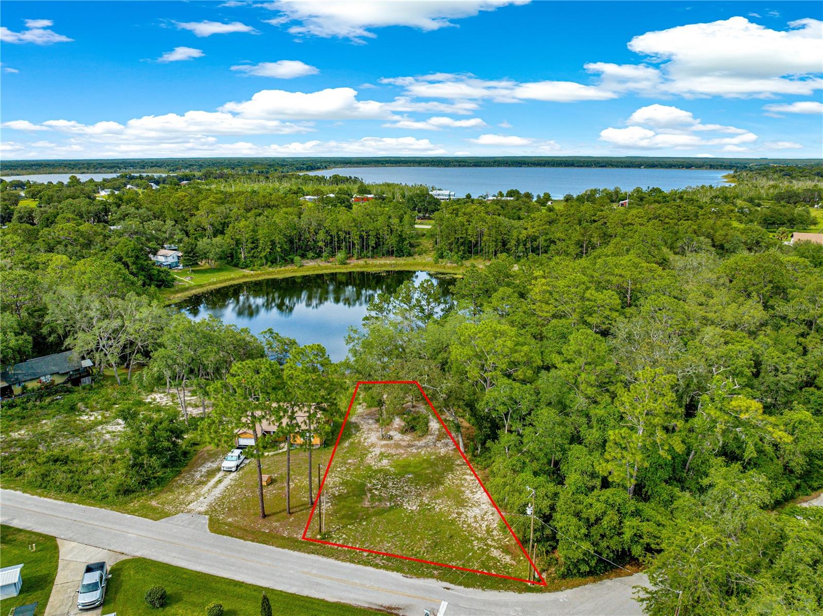 Build Your Dream Escape Home on Beautiful Lake Emerald on a pristine, cleared Lot in the Tranquil Ocala National Forest!
Don't miss this opportunity to own a peaceful 0.27-acre cleared lot nestled in the heart of the scenic Ocala National Forest, offering direct 40 feet of freshwater pond frontage. Located on a quiet, paved street, this residential parcel (zoned R1) is ready for your custom home or getaway cabin. Imagine walking out your back door and casting a line into your own private pond. Paradise!
Enjoy the best of Florida nature—fishing, hunting, and access to nearby spring-fed lakes—all just steps from your backyard. While secluded and tranquil, the property remains conveniently close to medical services, shopping, dining, and other amenities. Plus, you're only a short drive (under an hour) to the world-famous Daytona Beach!
With no flood insurance required (Flood Zone X), and easy access to the pond, this lot blends lifestyle and location. Whether you're looking to build now or invest for the future, this is an exceptional opportunity.
?? Road Frontage: 74 ft
?? Lot Dimensions: Approx. 40x74x175x208
?? Waterfront: Yes (Pond – 40 ft)
?? Zoning: R1 Residential
?? Utilities: Power, Phone, and Internet networks are already available inside the Woods & Lakes neighborhood.
?? Current Use: Subdivision
Schedule your showing today and explore the possibilities.