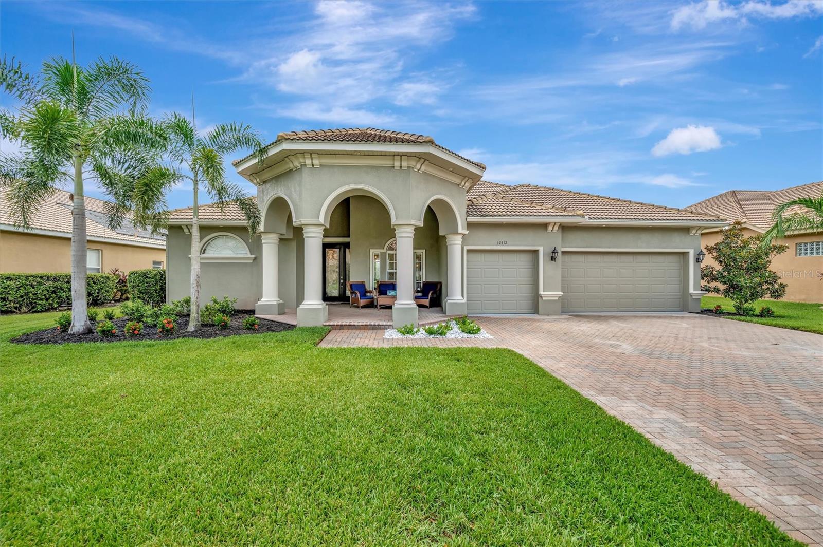 Welcome to 12412 Daisy Place, a beautifully upgraded 3-bedroom, 3.5-bathroom home located on an oversized .27 acre preserve lot in the prestigious gated community of Greyhawk Landing. Boasting 3,146 sq ft of living space and a thoughtfully designed layout, this home offers multiple flex areas that includes a den, office, and upstairs bonus room, stunning updates, and a true indoor-outdoor Florida lifestyle. The curb appeal impresses immediately with an oversized paver driveway, 3 car garage, covered front porch, and lush landscaping. Step inside to soaring ceilings, updated flooring throughout the main floor, and a light-filled interior. Each main-level room enjoys picturesque views of the pool and tranquil preserve backdrop. The heart of the home is the chef’s kitchen, complete with granite countertops, stainless steel appliances, gas range, wood cabinetry, and a large center island overlooking the spacious great room and casual dining nook. Ideal for both entertaining and everyday living. The first-floor primary suite is a luxurious retreat with dual closets, direct lanai access, and a spa-like ensuite featuring a soaking tub, walk-in shower, and dual vanities. Two additional first-floor bedrooms share a private wing separated by a full shower-tub combo bathroom. A third full bathroom is conveniently located just off the lanai—perfect for guests and pool days—and adjacent to the dedicated home office. Upstairs, a large bonus loft with half bath, offers endless possibilities: media room, playroom, home gym, or guest suite. Step outside to your private oasis—an extended screened-in lanai with heated pool and spa, all set against a peaceful preserve view with no rear neighbors. The spacious covered lanai provides the perfect setting for outdoor dining and lounging. Additional highlights include the 3-car garage, formal dining room and separate den, private office, dedicated laundry room with built-ins and utility sink, natural gas connection, and Low HOA fees ($75 Annually). Greyhawk Landing offers 24-hour gated security and resort-style amenities: two community pools, clubhouse, fitness center, tennis courts, basketball, baseball & soccer fields, miles of trails, and top-rated schools nearby. Just minutes from Lakewood Ranch, I-75, shopping, dining, and Gulf Coast beaches.
