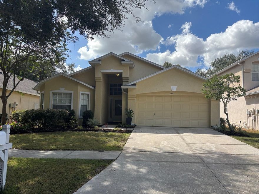 Convenient Location and Stunning Upgrades!! Open Great Room with Wood Floors, Formal Dining Room with furniture niche, Bright and Open Kitchen with Breakfast Bar, Stainless Steel Appliances, Upgraded Tile, and Eating Area PLUS a 3-way Split Bedroom Layout giving everyone their own space! Spacious Master Suite with Walk-In Closet, Dual Sinks, Garden Tub and Shower. Front Bedroom has a bay window and is closest to a full bath. Bedrooms 2 & 3 share a full Jack and JillBath -- Plus Closet Organizers in all four bedrooms! PLUS Storage Space in the semi-finished Attic with pulled down stairs. MUST SEE Florida Living Space with Screened Lanai with Sun Blinds and a lovely Private Backyard. Well Cared For Home is ready for New Tenants! Pavilion offers a great location -- convenient to I-75, 1-4 and the Crosstown Expressway -- Makes any commute easy! PLUS New Shopping Center at the beginning of the community. Be near to everywhere you need to be! Community also offers Community Pool, Clubhouse, Playground, Fitness Center, Basketball Court and Tennis Courts.