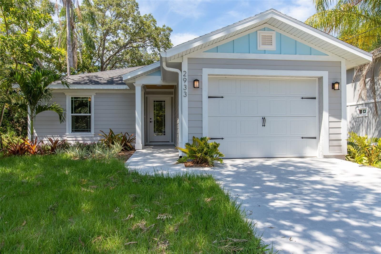 Adorable home built in 2021 in the heart of Sarasota. Designer furnishings from Crate & Barrel, West Elm, are blended with custom wood furniture. Situated in central Sarasota, Close to Siesta Key this spacious home is like new and designed to embrace indoor/outdoor living and entertaining. The short drive to Siesta Key, downtown, and the areas best dining makes this home the perfect location. A spacious lanai allows for great entertaining alongside a spacious deck for grilling. Upon entering the home, you will immediately notice the open floor-plan and vaulted ceilings filled with natural light. The kitchen has plenty of counter space and comes well equipped to cook a family meal after a day of fun in the sun. The primary bedroom includes a King sized bed as well as a private bathroom with walk-in shower, built-in dresser, and large custom closet. The secondary bedrooms share a bathroom, which includes a tub-shower. This home is thoughtfully filled with everything your family needs for a coastal beach getaway including games and beach equipment! The property is fully fenced with lush tropical landscaping. Guest will have private access to the entire property. Rental terms are flexible, open to longer leases. Furnishings can be adjusted to occupants needs.