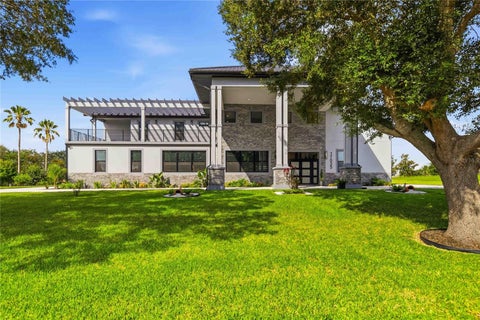 Photo of 17025 Royal Palm Drive, Groveland, FL 34736 (MLS # O6419022)