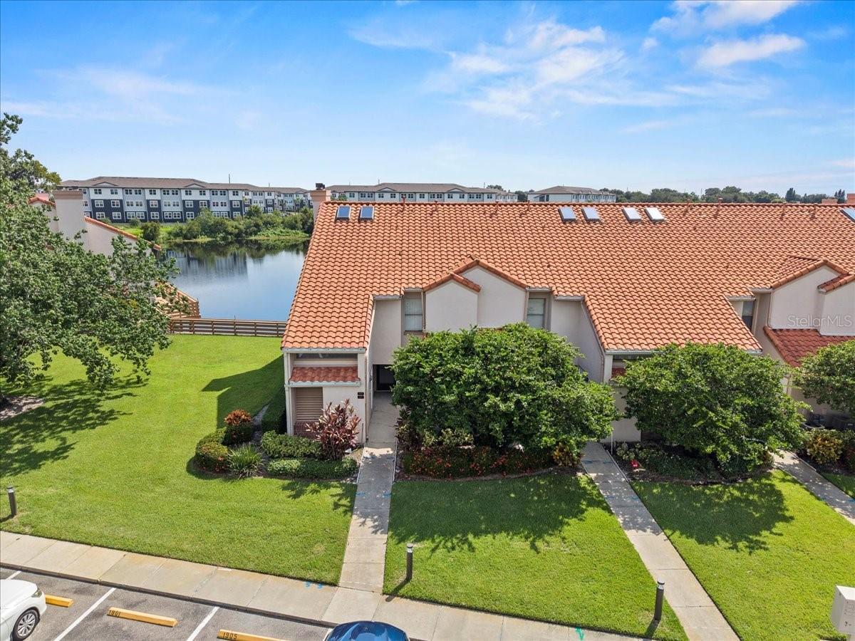 Experience the pristine, resort-like lifestyle at Winterset! This beautifully updated, end unit, first-floor 2-bedroom, 2-bath condo offers breathtaking panoramic views of Garden Lake. Residents enjoy an array of amenities, including a heated pool and spa, tennis courts, and a community pier on Lake Winterset—perfect for fishing, boat access, bike rides, and leisurely walks. This condo provides a true waterfront oasis, offering both relaxation and recreation right at your doorstep!
Upon entering the open foyer, you're greeted by a gorgeous kitchen that overlooks a spacious living room with two sliding glass doors, perfectly framing the glistening lake views. A gas fireplace adds cozy charm, while natural light fills the home, creating a bright and airy ambiance. Step out onto your covered veranda with glass and screen windows, leading to an oversized deck—ideal for enjoying morning sunrises and spotting turtles in the lake.
This condo boasts modern upgrades, including fresh paint, tile flooring throughout, updated ceiling fans and light fixtures. The kitchen is fully updated with new solid wood cabinets, backsplash, sink, faucet, black granite countertops, gas stove, and stainless appliances. A stackable washer and dryer is conveniently located inside the unit.
The primary suite features two closets, a stand-up shower, and a stylish vanity with granite countertops and a bowl sink, plus upgraded cabinets for extra storage.
An additional 6x3 storage space just outside the unit is perfect for a bicycle or extra items. Winterset offers low-maintenance living, with HOA fees covering exterior upkeep, landscaping, building maintenance, and roofing. The gated community provides a clubhouse, state-of-the-art security, and beautifully manicured grounds.
Conveniently located near shopping, restaurants, hospitals, medical facilities, and Legoland, this condo offers the finest in waterfront living within Winter Haven’s highly sought-after Winterset community.