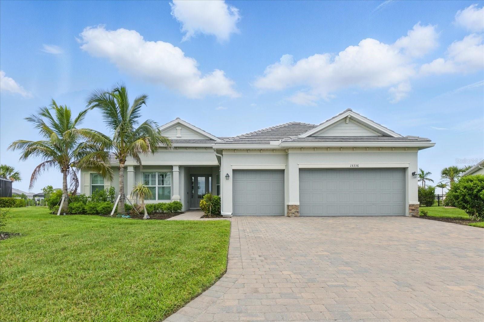 The spectacular Gulf-access waterfront saltwater heated pool and spa home situated on one of the largest tip lots in Harbor West. This oversized lot offers just over half an acre and features 165 feet of waterfront. This sailboat water property provides direct Gulf access with no bridges and is positioned on two intersecting, lake-like canals: Butterford and Aquarius Waterways. Enjoy colorful views from sunrise to sunset from the expansive 60’ x 35’ paver-bricked screened lanai.
The open-concept layout offers over 3,200 square feet of indoor and outdoor living space. The split-bedroom floor plan includes 3 bedrooms plus a flexible 4th bedroom space currently used as a home office. The bright and airy great room features a coffered ceiling with crown molding and 8-foot sliding doors that open seamlessly to the kitchen, dining room, and breakfast area. The kitchen includes shaker-style cabinetry with abundant pull-out drawers, including a pantry with custom pull-out shelving, a 10-foot center island that seats 4–6, stainless steel appliances (wall oven, microwave, electric cooktop, French door refrigerator, and double stainless sink), tile backsplash, and under-cabinet lighting with dimmers.
Throughout the home you’ll find granite countertops, wide plank tile flooring, oversized baseboards, crown molding, plantation shutters, 8-foot doors, designer light fixtures, ceiling fans, and a cohesive coastal color palette. The spacious owner's suite features coffered ceilings, French doors to the lanai, a large custom walk-in closet, and a spa-style bathroom with a tiled walk-in shower, dual sinks, vanity area, linen closet, and private water closet. Guest bedrooms also offers tile flooring, ceiling fans, and custom closet shelving. There is a full hall bath and a convenient pool half bath accessible from bedroom 3.
The laundry room is equipped with washer and dryer, utility sink, and upper cabinets. The oversized 3-car garage includes epoxy flooring, overhead storage racks, steel cabinetry, exterior keypad, pull-down attic access, and 15x15 floored attic space. The property showcases meticulous care and attention to detail at every turn. Resort-inspired landscaping and lighting accent the tropical gardens, coconut palms, and spacious backyard.
The 20x60 Hardy Plank boat dock includes a 32-foot slip, 13,000 lb boat lift, fish cleaning station, dock boxes, water, fish lights, motion-sensor lighting, and night lighting. Additional upgrades include a fenced yard with wide-access gates, dimmers throughout, upgraded Sherwin-Williams paint, MyQ garage openers, and a new roof and lanai cage (2023). Furnished for the convenience of the buyer.
Harbor West is a gated community with low HOA fees covering irrigation, lawn care, tree and shrub maintenance, and all common areas. Conveniently located within a short drive to Englewood Beach, Boca Grande, waterfront dining, shopping, and airports. Private guided boat tours available upon request to truly experience the Florida Gulf Coast lifestyle.