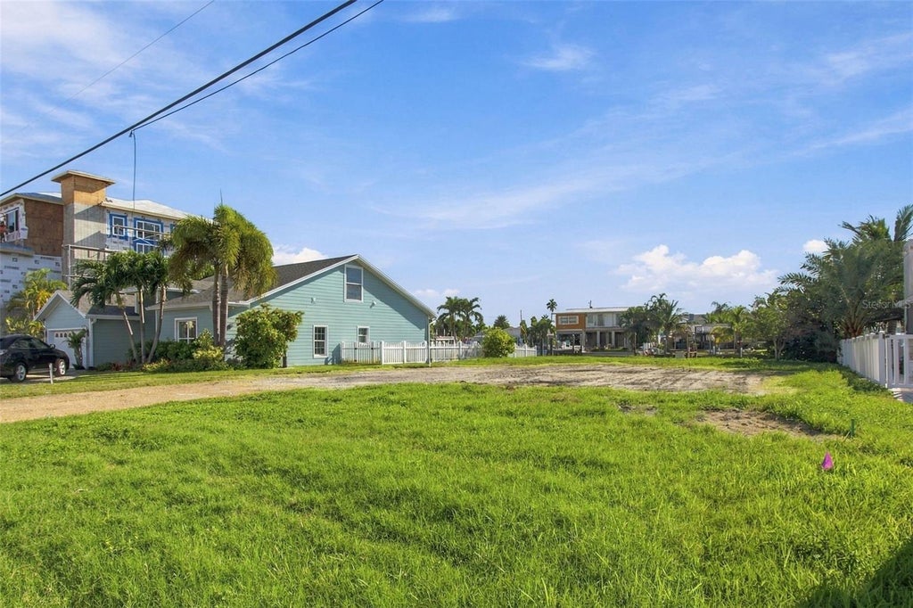 Photo of 553 Crystal Drive, Madeira Beach, FL 33708 (MLS # TB8559440)