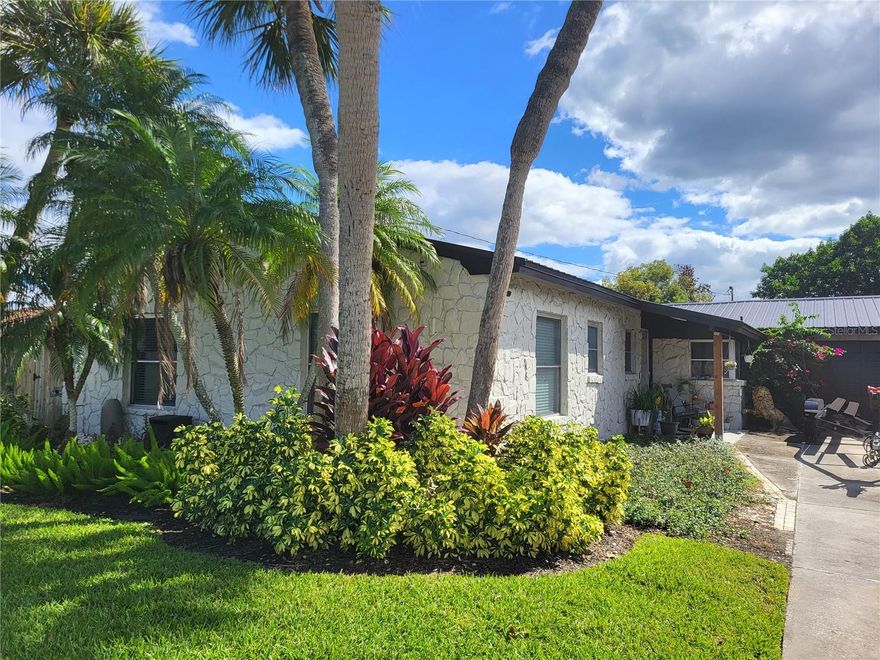 Welcome to a rare hidden gem in Orlando — tucked away on a quiet canal off Clear Lake, one of the only places in the city where you can enjoy true skiable lakefront living. The homes in Isle of Catalina offer a unique lifestyle defined by boating, sunset views, mid-century character, and unmatched privacy — all within Orlando’s city limits. This residence features three bedrooms and two bathrooms, along with formal living and dining areas, an expansive Florida room, and a guest suite thoughtfully built within the garage. Inside, the home’s open and spacious layout provides an ideal flow for both entertaining and everyday living. The oversized Florida room is filled with natural light and centered around a cozy wood-burning fireplace, creating a perfect year-round gathering space. With timeless mid-century architecture, mature tropical landscaping, and the serene backdrop of the canal, this property perfectly captures the essence of relaxed waterfront living. Located just minutes from Downtown Orlando, major highways, and the area’s top attractions, this home offers a rare combination of tranquil lakefront living and urban convenience.