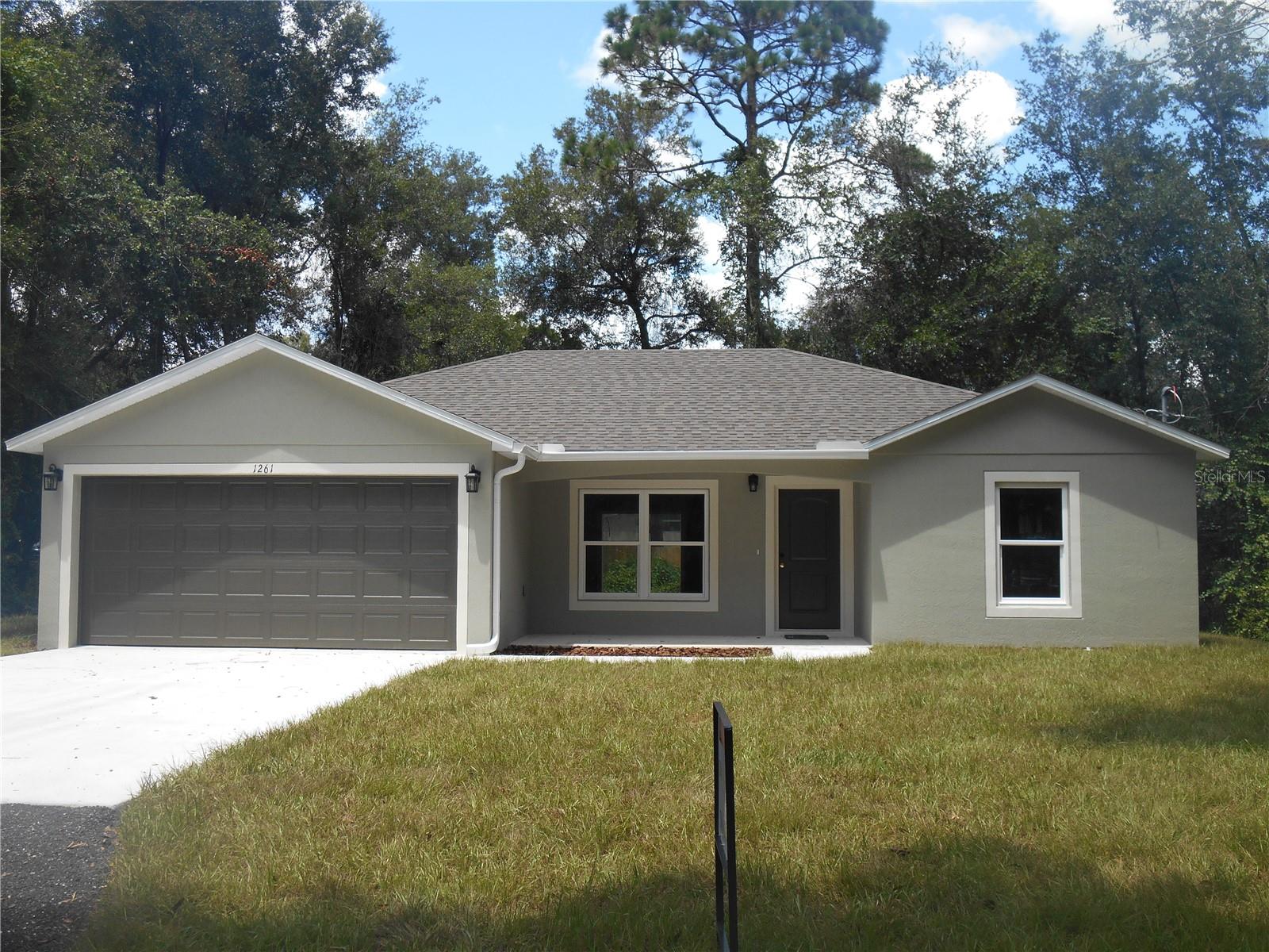 This beautiful home is only 4 years old. The home has a large OPEN FLOOR PLAN. The kitchen has SOLID WOOD cabinets with soft close hinges & drawers, APPLIANCES include microwave over the range, range, refrigerator with ice maker and dishwasher. There is a KITCHEN ISLAND with pendant lighting over the breakfast bar & recess lighting. The living room is large and open to the kitchen. The master bedroom is large and includes a walk-in closet and a master bath with double sinks, large shower with seat and a linen closet. The home also has an INSIDE LAUNDRY ROOM. This home has so many features and a lot of character. It includes block construction, cathedral ceilings, plant shelf, ceiling fans, updated lighting & switches, double pane/tilt out windows, water filter, well (so no water bill), garage door opener, PORCELAIN "wood look" floors thru out the home. HURRY BEFORE IT IS GONE!