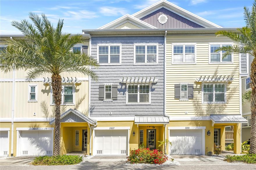 Coastal luxury meets effortless living in this beautifully appointed townhome located in The Cove at Loggerhead Marina — an exclusive gated waterfront community inspired by Key West charm. Perfect for boaters and nature lovers alike, this community is uniquely situated within the grounds of Loggerhead Marina, with convenient access to its full-service marina and open waterways including Tampa Bay, Boca Ciega Bay, and the Gulf. Ideally positioned overlooking a landscaped community greenspace, the home enjoys a pleasant, open view that adds to the relaxed coastal setting. This three-story townhome with a private elevator offers 3 bedrooms, 2.5 baths, and a versatile bonus room ideal as a home office, den, or guest space. The main living level features an open-concept design with volume ceilings, crown molding throughout, and abundant natural light. The kitchen is beautifully updated with 42" cabinets (refinished in 2026), quartz countertops, pantry, and new stainless steel appliances (2025). Enjoy the screened porch just off the main living area — perfect for morning coffee, relaxing evenings, or entertaining while enjoying views of the landscaped community grounds. Upstairs, the spacious primary suite includes a sitting area overlooking the greenspace, a walk-in closet, and an en-suite bath with dual sinks, a seamless walk-in shower, and private water closet. Two additional bedrooms, a full guest bath, and a laundry room complete the upper level. The oversized tandem two-car garage provides generous storage and features a new epoxy-coated floor (2026) — ideal for beach gear, bikes, and more. Just outside, the extended patio creates a wonderful outdoor space for entertaining or relaxing. Notably, this property experienced no flooding during Hurricanes Helene and Milton, offering added peace of mind. Additional updates include new carpet (2025) and a newer hot water heater (2024).Residents of The Cove enjoy resort-style amenities including a waterfront pool, Tiki hut with cable TV and power, the Captain’s Lounge for social gatherings, walking paths, and community-wide mosquito control included in the HOA dues, along with many other covered services and utilities. Just outside the gates, miles of biking and walking trails connect throughout St. Petersburg and Pinellas County. Unbeatable location: only 8 minutes to downtown St. Petersburg, 10 minutes to world-renowned St. Pete Beach, and 25 minutes to Tampa via nearby I-275.Live where refinement meets nature — at The Cove at Loggerhead Marina.