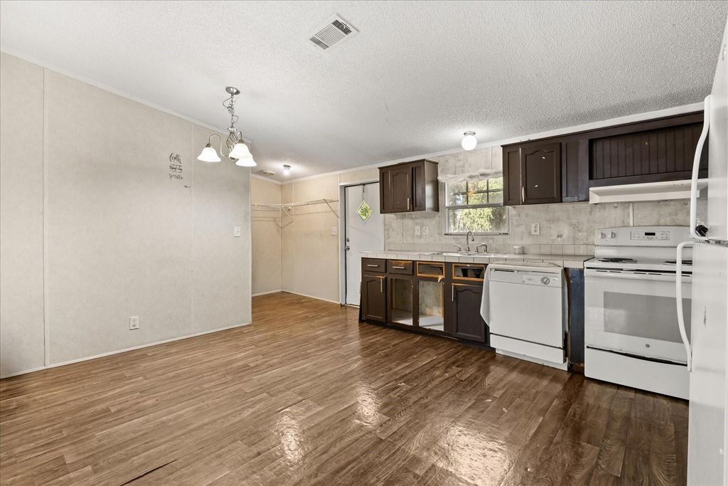 Photo of 10385 SW 152nd Place, Dunnellon, FL 34432 (MLS # O6370485)