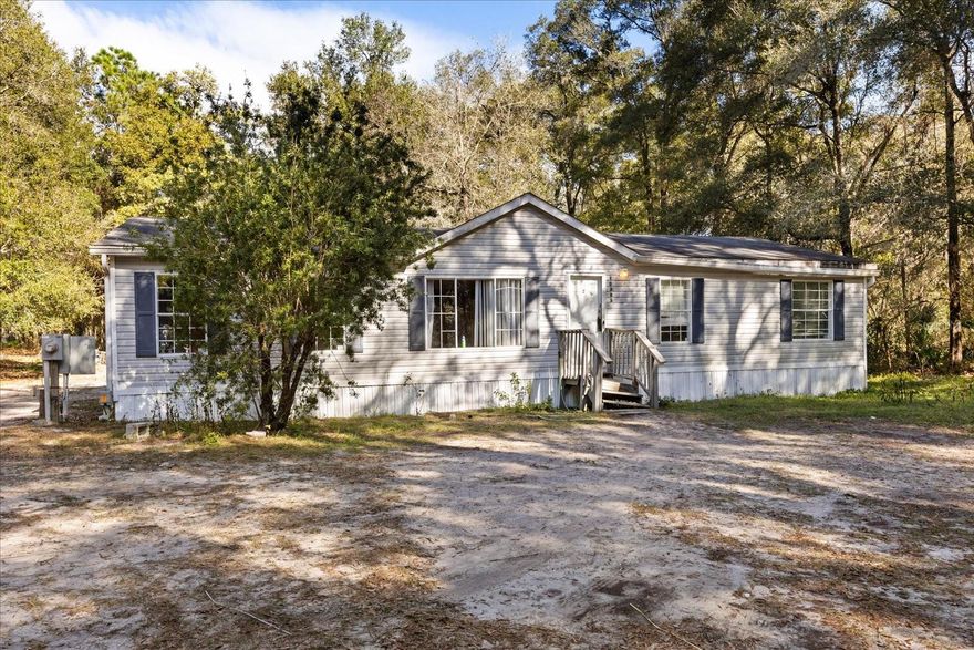 Opportunity awaits with this double-wide mobile home on 1.25 acres of non-leased land in Dunnellon, tucked away on a quiet dirt road and shaded by beautiful, mature oak trees. Enjoy peace, privacy, and the charm of rural living while still being close to everyday conveniences.

The mobile home is a true fixer-upper handy man special and is being sold as-is, making this property ideal for investors, cash buyers, or buyers looking to renovate, replace, or rebuild. With no HOA and no lot rent, the real value here is the land, location, and potential after repair value.

Conveniently located near shopping, dining, schools, and the growing Dunnellon/Ocala area, this is a rare chance to secure acreage at an increasingly hard-to-find price point.

Cash or renovation loans preferred.
No HOA. No lot rent. Endless potential.