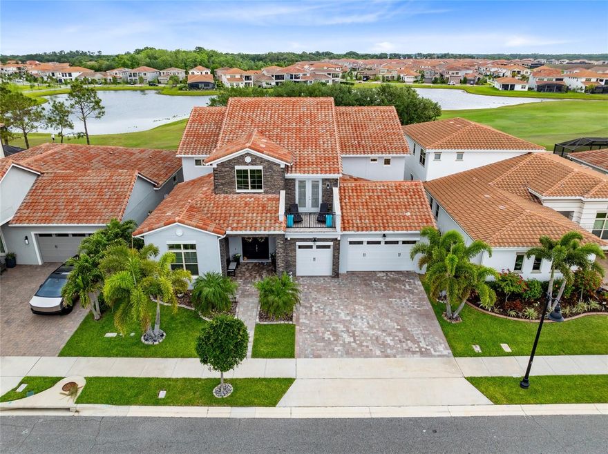 Welcome to your dream home at 13307 Alderley Drive, a splendid custom-built, two-story contemporary executive pool home in the highly sought-after Eagle Creek Golf and Country Club. Spanning over 5,700 sq. ft., this stunning Ponte Vedra model features five bedrooms and six full bathrooms, all brimming with luxurious upgrades. An elevator equipped with a landline phone, a whole-home dehumidifier, a surge protector, and a Pentair water treatment system are just the beginning of what this spectacular residence has to offer. Step inside to a grand foyer with soaring 21-foot ceilings that lead to a spacious open floor plan showcasing breathtaking golf course and water views. The gourmet kitchen is a chef’s delight, featuring high-end stainless steel appliances, a hooded vent, a gas cooktop, double built-in ovens, wood cabinetry, granite stone countertops, a custom tile backsplash, and a massive island with eat-in space and a coffee bar. The adjacent dining and living areas are perfect for entertaining, with four-panel disappearing sliding glass doors opening to a large patio overlooking the pool and golf course. A dedicated office/den space with its own sliding glass door offers serene views, while a convenient full pool bath provides easy access from the patio. The first-floor guest suite comes complete with a full bathroom and linen closet for added convenience. Upstairs, you’ll find a Junior Master suite with an attached ensuite and a private balcony at the front of the home, along with two additional bedrooms that share a double vanity bathroom. The expansive flex room is perfect for recreation or entertainment, featuring a wet bar with a dishwasher, beverage cooler, and a kitchen-sized sink, along with four-panel sliding glass doors that lead to an extended balcony with stunning views, complete with a remote-controlled rolling screen for added comfort. This home also boasts a dream home gym, complete with a sauna for eight, a full bathroom with a glass-enclosed shower, and a second laundry area. Outside, enjoy an oasis of outdoor living with an oversized covered patio, a mounted flat-screen TV space tailored for your personal setup, a Paradise Summer Kitchen, and a modern saltwater pool and hot tub with waterfalls and premium color lighting. Remote-controlled retractable screens enhance your outdoor experience, while Easy Turf premium field turf surrounds the pool deck. With a spacious three-car garage and access to the community’s exceptional amenities—such as resort-style pools, tennis courts, and walking trails—this home is perfectly located near Lake Nona's Medical City, top restaurants, shopping, and major highways. Don’t miss your chance to see this incredible property—schedule your appointment today!