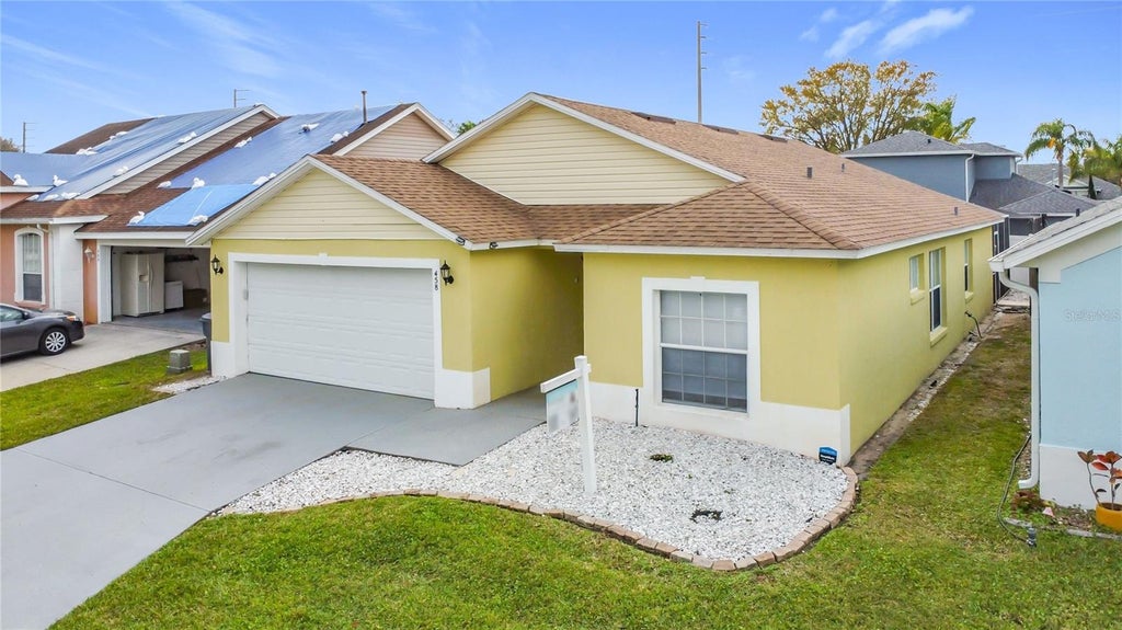 Photo of 458 Hollinghead Loop, Davenport, FL 33896 (MLS # O6416303)