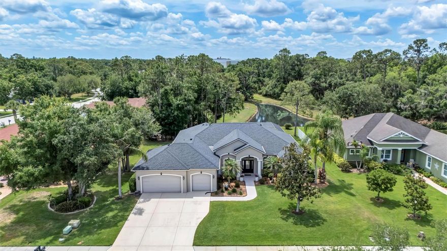 From the moment you step through the front door, your eyes are drawn straight to the long lake views—setting the tone for everything this home has to offer. This meticulously maintained 3-bedroom, 3-bath pool home with a dedicated home office/den blends comfort, functionality, and a truly beautiful setting.

Inside, you’ll find a well-designed layout with a private guest suite featuring its own en-suite bath—perfect for hosting family or friends. The additional bedroom and full bath provide comfortable space for guests, while the separate office/den offers flexibility for working from home, hobbies, or a quiet retreat. The home has been lovingly cared for, including a new roof installed in 2021, offering peace of mind to the next owner.
Step outside to an inviting pool and patio area made for Florida living—whether you’re enjoying quiet mornings overlooking the water or entertaining in the evening.
Situated on nearly half an acre, the property offers plenty of room to spread out, along with an oversized 3-car garage for all your storage needs.
With low HOA fees and no CDD, and A rated school district this home delivers both value and lifestyle in one exceptional package