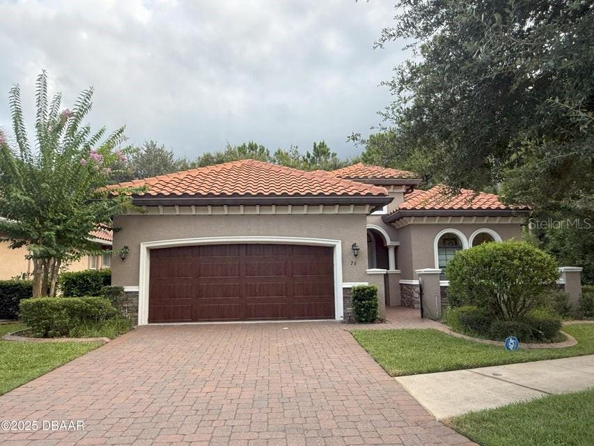 Move-In Ready!!! 3 bedrooms, 2 baths. Covered screened lanai next to a conservation area and cul-de-sac in a Gated Community. Close to the highways, beach, shopping centers, airport, speedway, hospital, and restaurants. New flooring 2020, new gutter, new alarm system, and new plantation shutters. Tile roof, brick paver driveway, and gates throughout. The kitchen features soft-close wood panel cabinets with overhead lighting, crown molding, granite countertops, and a spacious pantry. The home has 10' tray ceilings. WOW! HOA includes gated entry, landscaped common areas, lawn maintenance, and irrigation water--no more mowing or watering on a meter! Square footage received from tax rolls