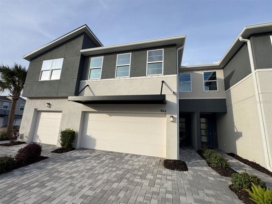 MODEL Home available!  This Award-Winning Sebring townhome with Modern exterior design lives like a single-family home. This impressive two-story townhome is 2,243 square feet with 3 bedrooms, 2.5 baths, and a 2-car garage. On the first level of this home, you will find a designer kitchen with abundant cabinet space and a center island. The cabinets are upgraded throughout, Glacier Gray shaker style including brushed nickel hardware. This home has quartz countertops color matched to flow with the design features. The tile backsplash in the kitchen is principal glass in a modern finish, that brings out the veining in the countertops and compliments the cabinets. This home comes with stainless-steel Whirlpool appliances, including the refrigerator and the washer/dryer are included as well. The Dining Area and Great Room naturally flow together, and a triple slider lead out to the lanai that is completely screened in to entice outdoor living. There is a powder room on the main floor for added convenience. Upstairs, an amazingly spacious loft is versatile and can be used as a second living space, media room, or play area. The Owner's Suite is separated from the secondary bedrooms by the loft and includes large split closets. The Owner's Bath features raised-height dual-sink vanity and large shower with a privacy window. Two secondary bedrooms share a full bath and feature walk-in closets as well. The Smart Home Tech package is includes an Ecobee Thermostat and Video Door Bell. The location of this Brandon community is minutes to all of the conveniences that the area has to offer including top rated schools.  Photos, renderings and plans are for illustrative purposes only and should never be relied upon and may vary from the actual home. Pricing, dimensions and features can change at any time without notice or obligation. The photos are from a furnished model home, furnishings are negotiable.