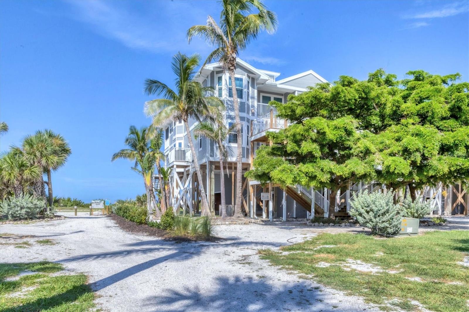 AMAZING PRICE! AMAZING LOCATION! 3 bedroom, 2.5 bathrooms, Gulf Front condo in the heart of the sought after Palm Island Resort. Located across from the only restaurant on the island, Rum Bay. The panoramic views of the Gulf and the 7 miles of pristine sandy beaches will have you relaxed in no time. This well appointed home has Corian counters, plenty of cabinet space with slide out drawers, extra large and deep sink. Your family and guests will enjoy the breakfast bar with stools as you gather around the kitchen. The dining area is full of natural light, has a wine fridge, and a dining table and chairs for 6. Beyond that is your beachy, cozy living room with a large mounted TV and sliders that bring you out onto the lanai for those spectacular views and sunsets. The 3 bedrooms are all equipped with California Closets for even more storage. The 2nd bedroom has been set up as an office with a queen size Murphy bed that looks like a wall cabinet. There is a built-in desk and shelves along the opposite wall. The primary suite has 2 closets, one large walk-in and one with dual doors that slide. The walk-in shower has a river stone floor, and is equipped with grab bars and built-in shelves for toiletries. The bedroom has a bow window with cushioned window seat that is perfect to curl up on and read a good book with a view of the Gulf. The association is diligently working on final repairs from the past hurricanes. The elevators should be up and running soon along with finishing up the lanai and outside stairs. The seller has and will pay for all fees and insurance assessments for the year 2025. Buyer won't need to worry about those until January 2026. There is a large community pool with restrooms, shower, entertainment area, tables, chairs and umbrellas. There is also an in-ground hot tub. Golf carts, walking and bicycles are the modes of transportation. There is a bellstaff that will happily transfer you around inside the resort and help with unloading and loading your belongings. Getting to your oasis in paradise is a 4 minute car ferry ride from the mainland. On the mainland side is plenty of restaurants, golf courses, shopping, and of course, more beaches. Come get your piece of paradise at this remarkable price!