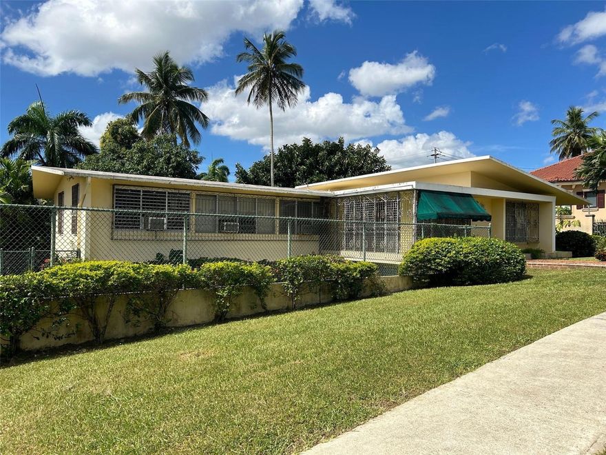 Located within the gated community of Garden Hills Norte in Guaynabo, Puerto Rico, this spacious residence offers a unique opportunity for large-lot living with premium redevelopment potential. The home features approximately 3,118 sq. ft. of interior space set on an oversized 928.68 m² lot, providing abundant room for custom upgrades and outdoor living.
The current configuration includes four bedrooms and four bathrooms, a two-car carport and extended driveway, plus patio and porch areas that invite a tropical indoor-outdoor lifestyle. With a strong foundation and solid construction, the residence presents an ideal blank canvas for transformation into a modern luxury designer home featuring an open concept floor plan, gourmet chef’s kitchen, resort-style pool and lounge deck.
Garden Hills Norte is highly sought after for its location, privacy, and quality of community living. Situated minutes from top schools, fine dining, upscale shopping and major highways, this property offers both a rare renovation prospect and long-term appreciation potential within premium Puerto Rico real estate and Guaynabo real estate.