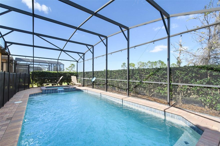 Back on conservation! This beautifully maintained and fully furnished 8-bedroom, 6-bath pool home is located in the highly sought-after Windsor at Westside resort community, one of the most popular vacation destinations near Disney. Designed for both comfort and functionality, the home features a spacious open-concept layout with a modern kitchen equipped with solid surface countertops, quality appliances, and ample storage. The dining area flows seamlessly into the inviting family room, offering plenty of space for gathering and entertaining.
The primary suite is conveniently located on the first floor and features a large bedroom, generous closet space. An additional bedroom suite on the first floor provides added flexibility for guests. Step outside to your private screened-in pool and spa, along with a covered lanai perfect for outdoor dining and relaxation. Windsor at Westside offers resort-style amenities including a clubhouse, lazy river, resort pool, fitness center, and more. Ideally located just minutes from Disney, shopping, dining, and major attractions, this property is perfect as a vacation home or a high-performing short-term rental investment.