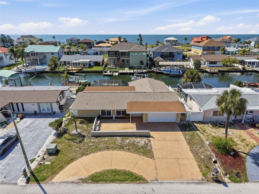 Welcome to your waterfront retreat in Hudson, Florida, just minutes to the Gulf by boat! This hard to find, over 1,700 sq. ft. 4-bedroom, 2-bath home sits on a canal and offers the perfect blend of coastal living and comfort.
Enjoy Florida living with a large screened-in pool featuring newer screens, a new pool pump, and a paved outside patio area ideal for entertaining. The west-facing lanai allows you to relax poolside while taking in some of the most spectacular sunsets you’ll ever see.
Boaters will appreciate two private docks, one of which is only two years old, along with a boat lift equipped with a new controller, making quick Gulf access effortless.
Inside, the home features ceramic tile throughout with new wood-look tile in the bedrooms, primary suite, dining room, and living room. The updated kitchen showcases new cabinets and beautiful granite countertops, while both bathrooms also feature granite countertops and new vanities, and beautiful glass enclosed tiled showers, giving the home a fresh, modern feel.  
The spacious primary suite includes an impressive 12 x 9 walk-in closet and its own private bath, while the large 11 x 8 laundry room provides extra functionality and frees up valuable garage storage space.
Major updates offer peace of mind with a brand-new roof and brand-new HVAC system. Additional highlights include hurricane shutters, a large open front porch, and appliances that are negotiable.
Whether you’re looking for a primary residence, vacation getaway, or waterfront investment, this home delivers direct Gulf access, a private pool, and the best of Florida coastal living.